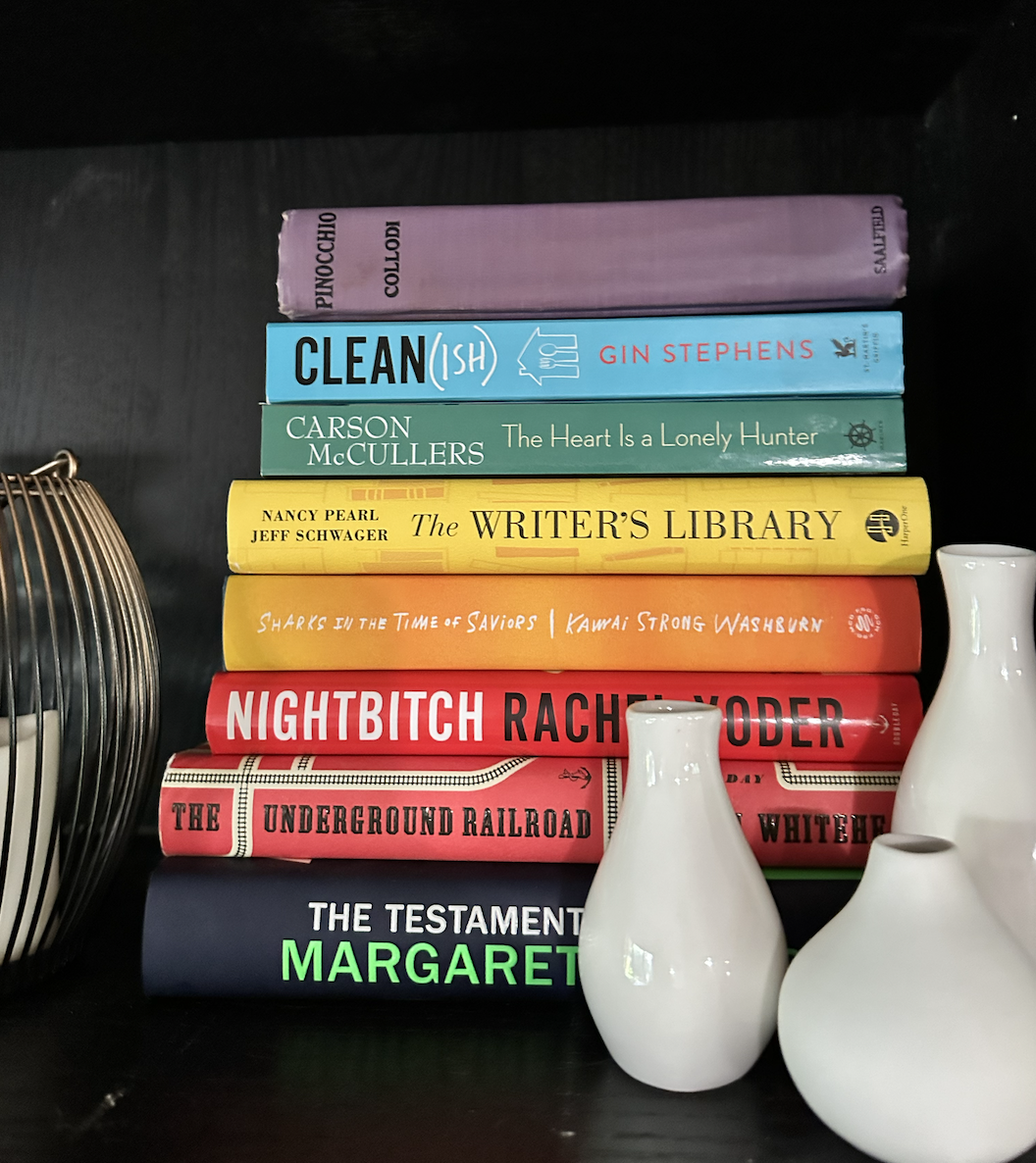 AFTER: a little "pride corner" on an otherwise fairly monochromatic shelf for a little serotonin boost 