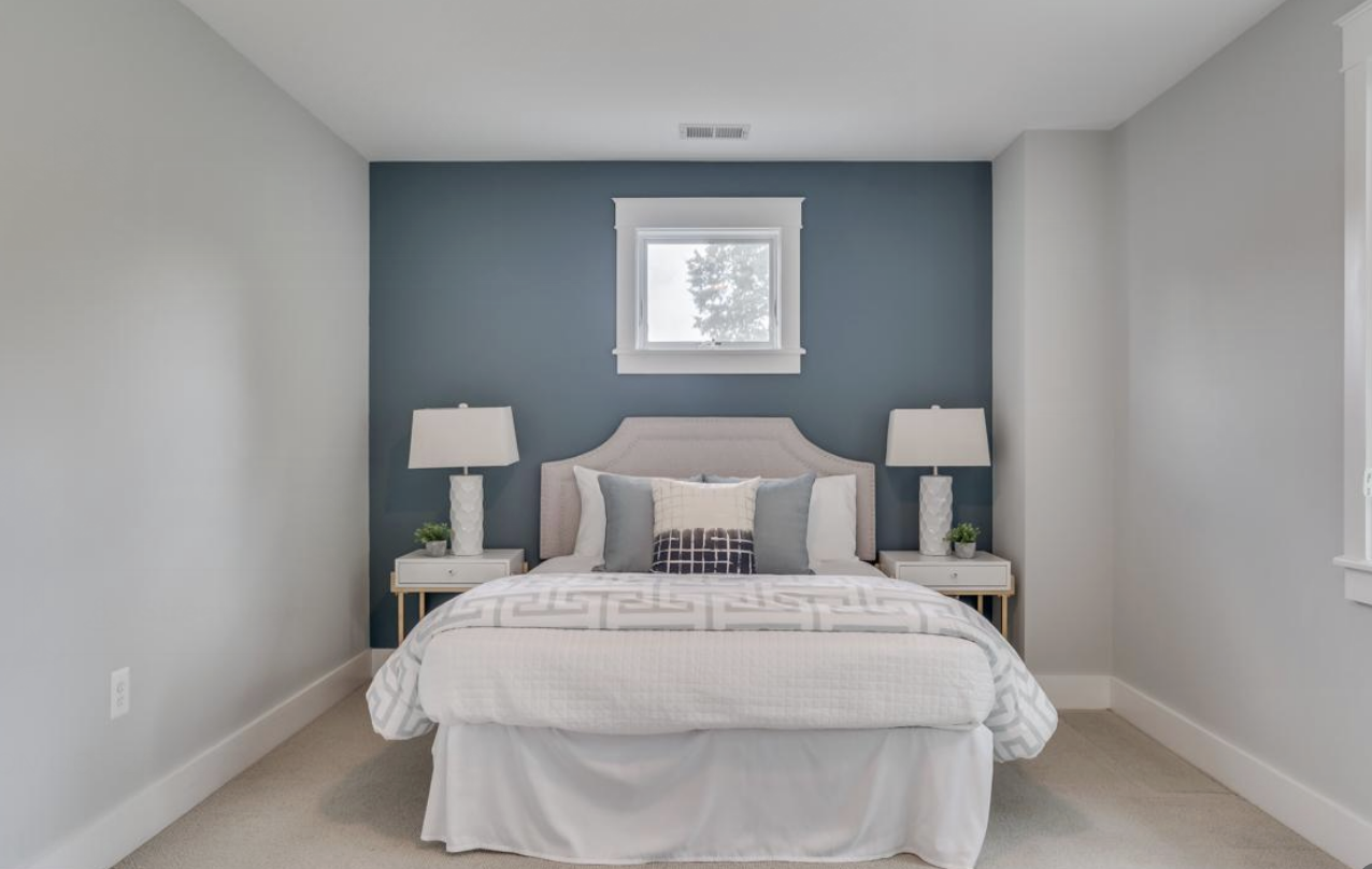 GUEST BEDROOM BEFORE: perfectly lovely for a real estate staging photo, but my son was DISMAYED to find out this was to be his bedroom