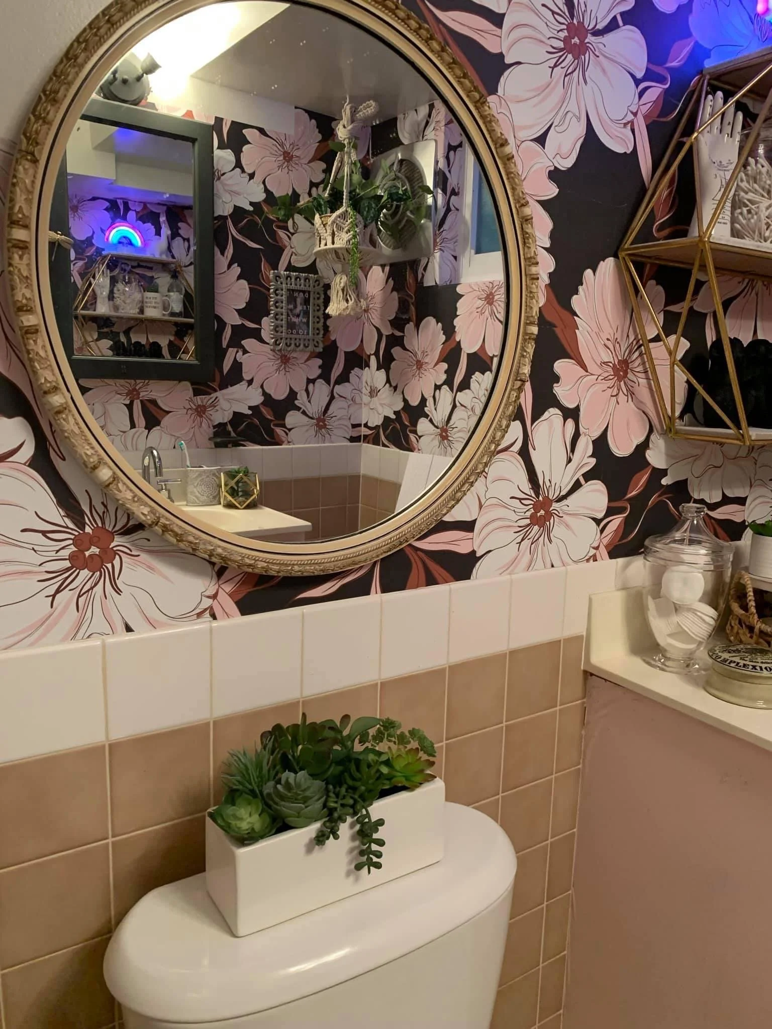 AFTER: yes, it's weird to put a mirror over a toilet, but she needed it to see the back of her head in the vanity mirror when doing her hair. 