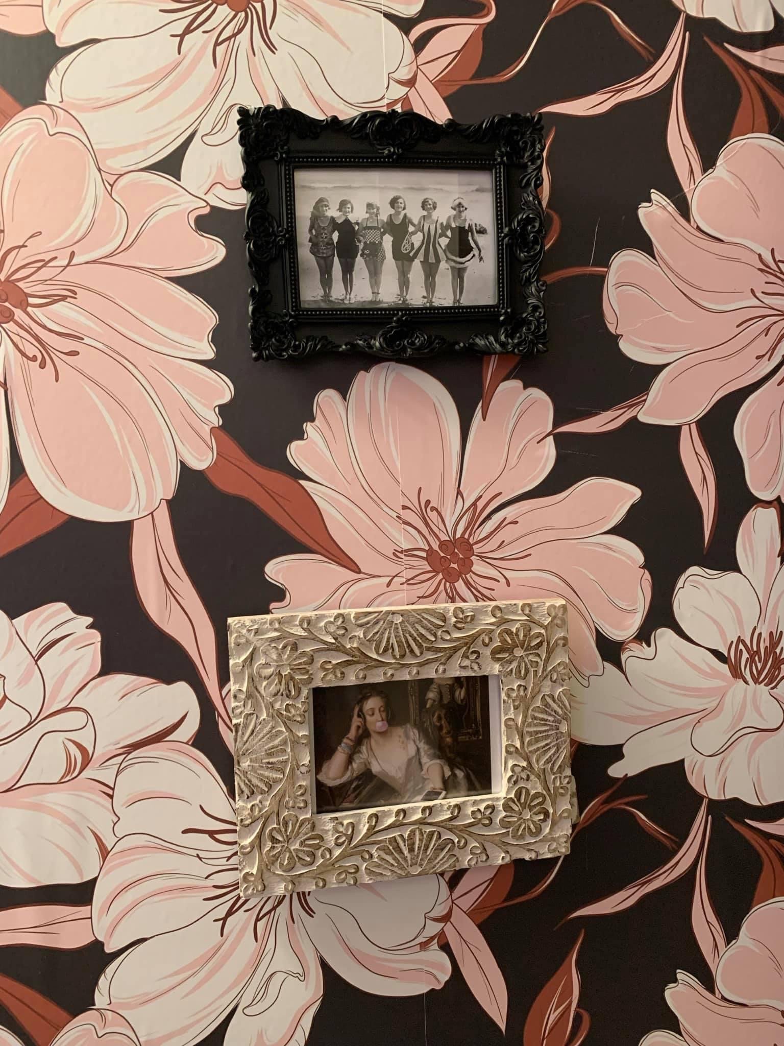 AFTER: Most of the art I chose for this space was based on sassy women in vintage photography, including a few photoshopped pieces, like Marie Antoinette blowing bubblegum...