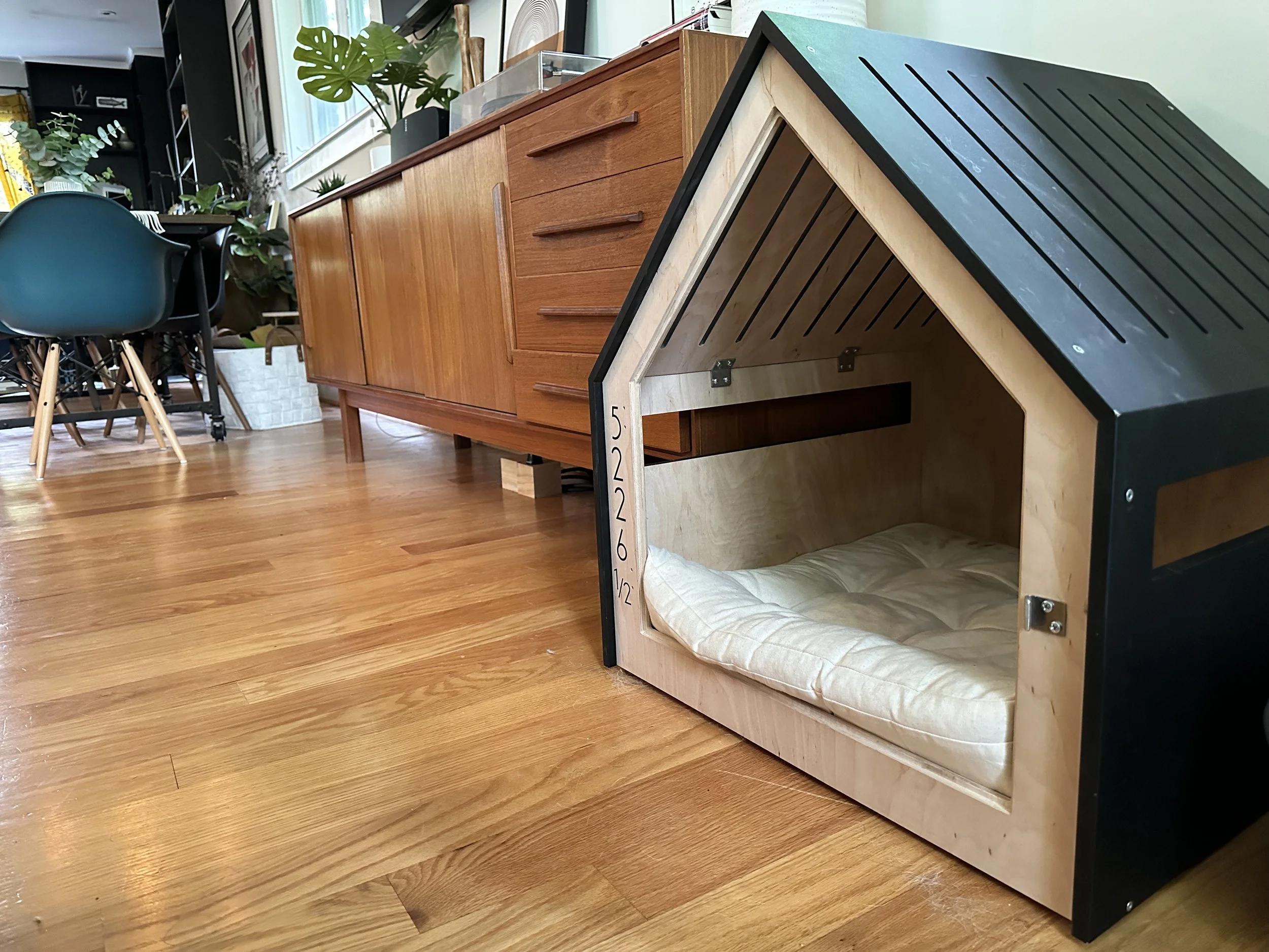 A little indoor house is the family dog's "safe space" and home base. His house has an address, too! 