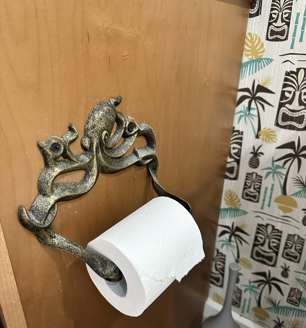 AFTER:...and his friend, the toilet paper holder!  You can't get away with details like this in a traditional bathroom, but if you're leaning fully into a theme (my favorite thing to do), little surprises like this are part of the fun 