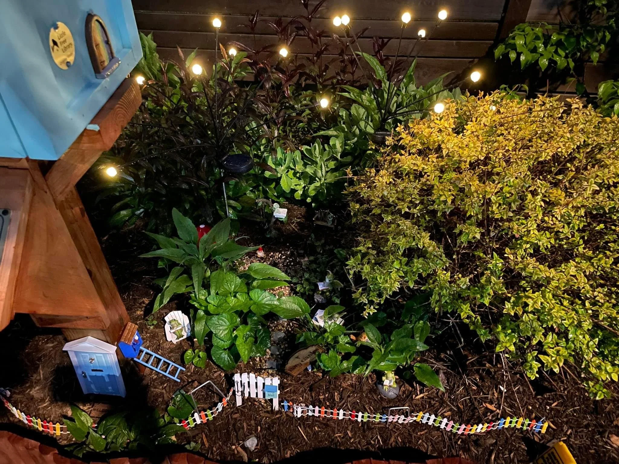 the little fairy garden with solar fairy lights next to our Little Free Libraries 