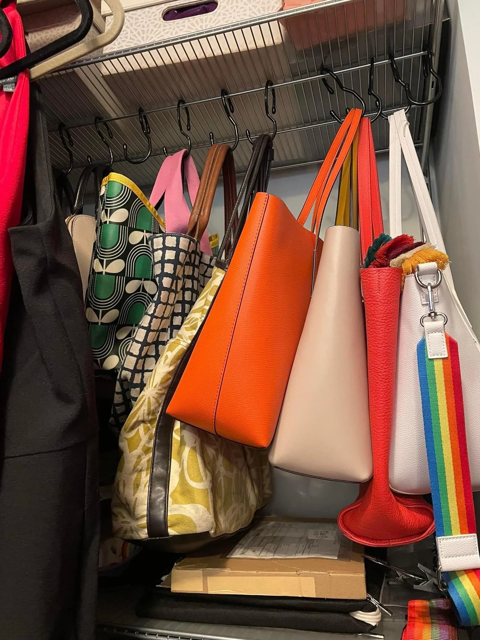 This is not that impressive, but you'd be surprised how happy it will make you to take all your purses and hang them up by color so they're not all in various stages of wilting on a closet shelf. It helps them keep their shape much better. You can us