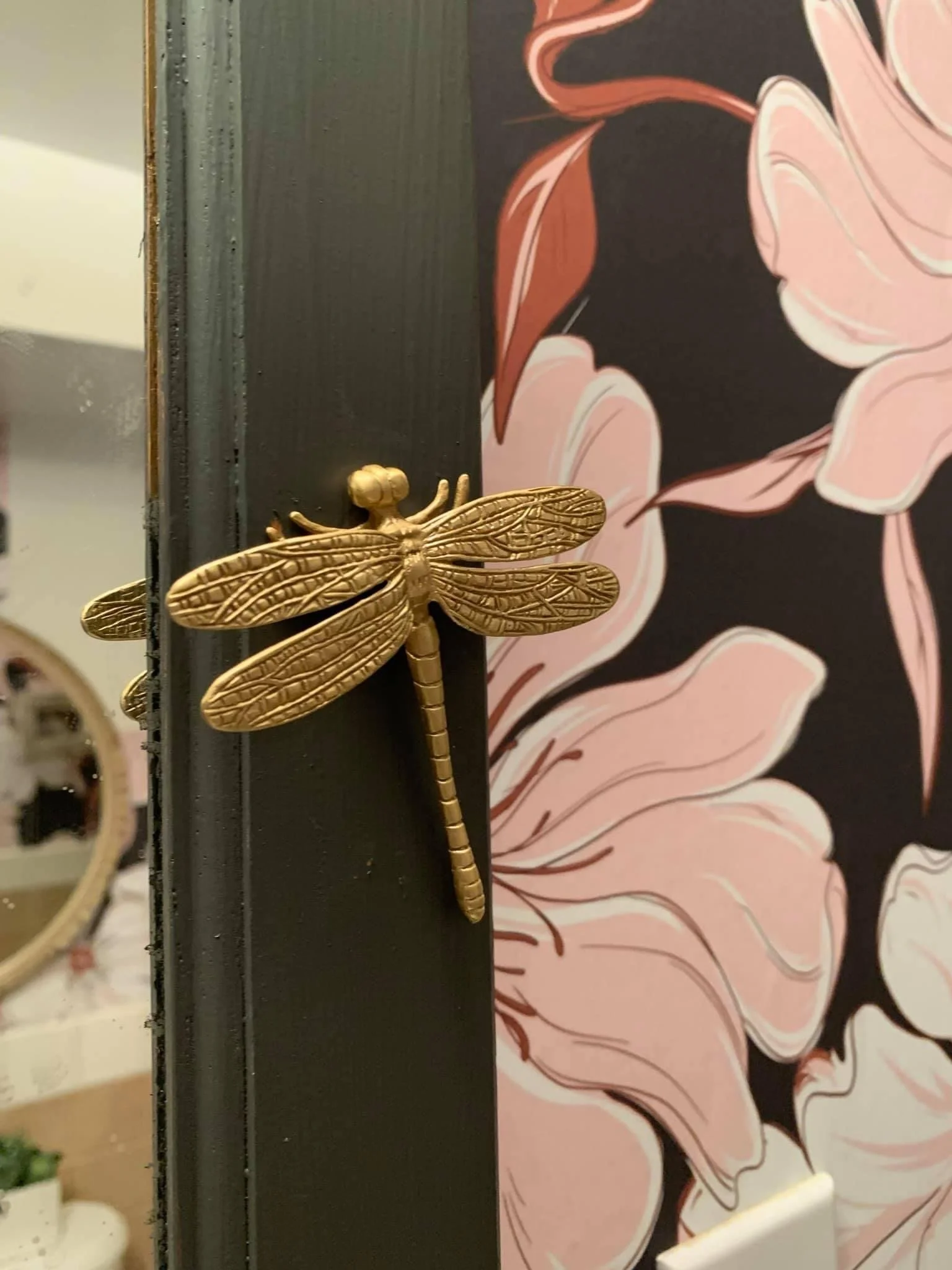 Fun little details like a brass dragonfly medicine cabinet knob can really bring a sense of wonder and delight to small spaces  