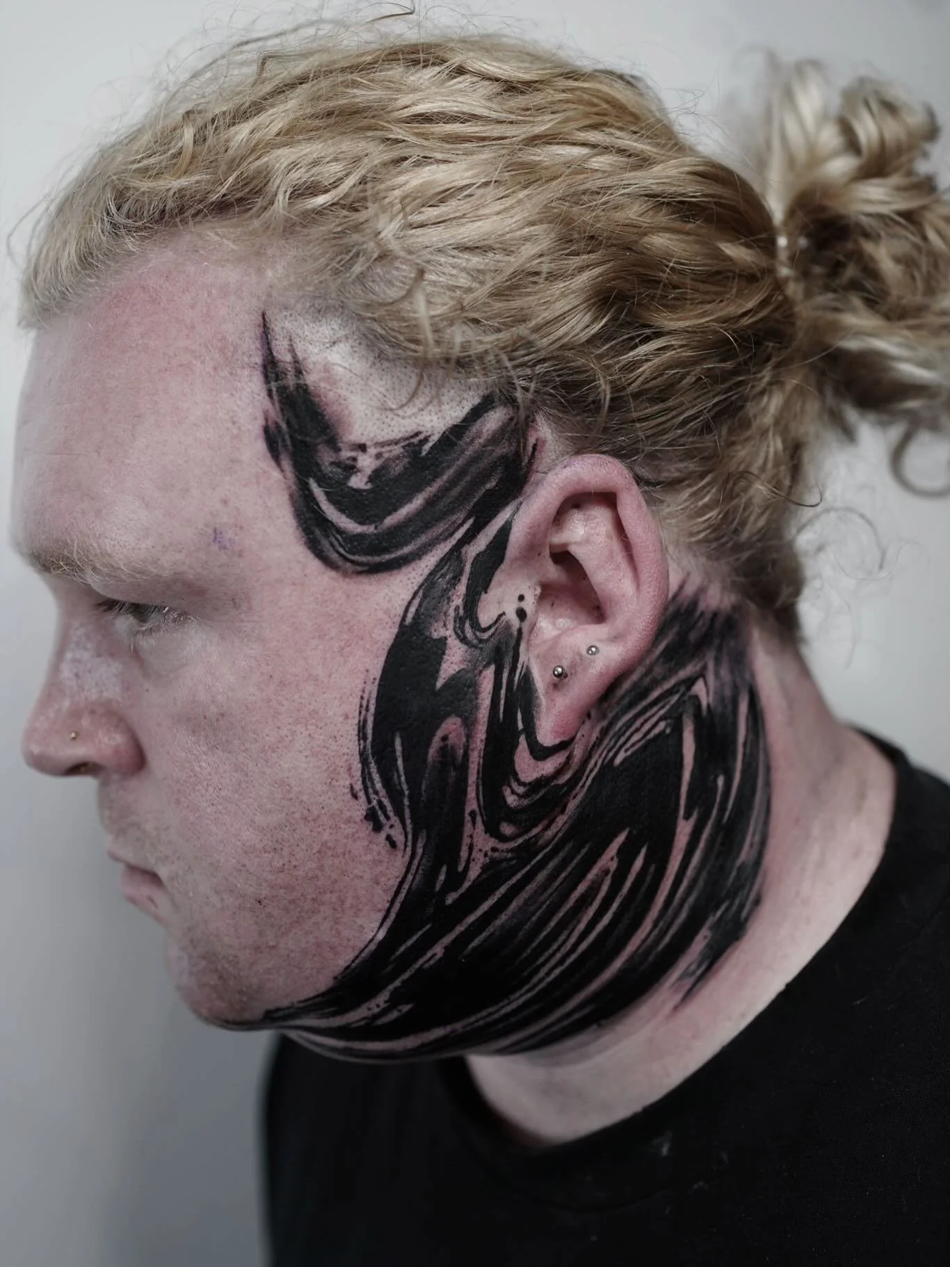 Abstract face and neck banger from our resident artist @bellatrix_tattoo ✨ 
.
To book in with Rachel please DM them directly or send a request via our website (link in bio)
.
Ready to bring your next tattoo idea to life? Head over to www.blacktapestr