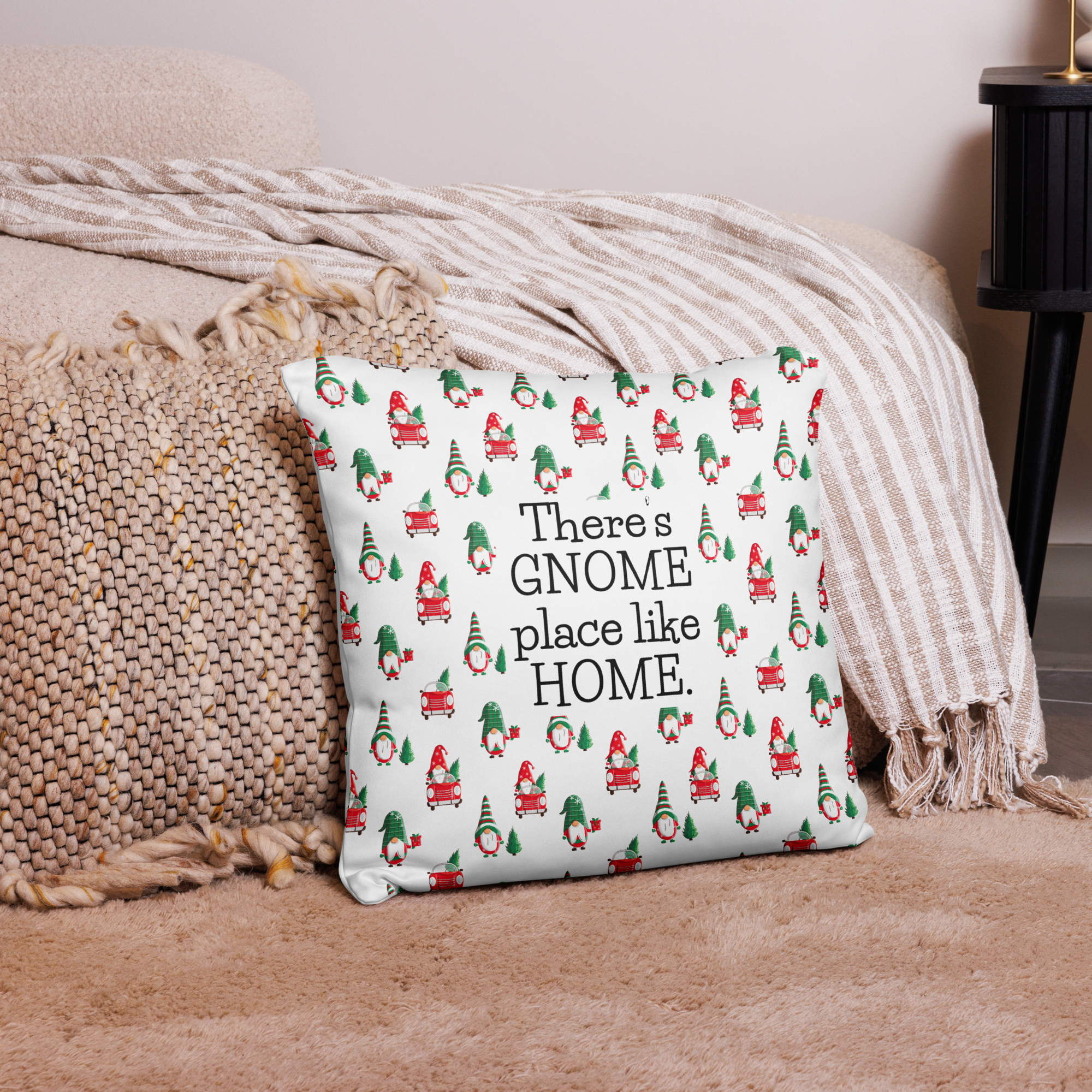 Lifestyle photo of a 18 x 18 inch throw pillow with the phrase There's Gnome Place Like Home with a festive pattern of Gnomes and Christmas Trees.