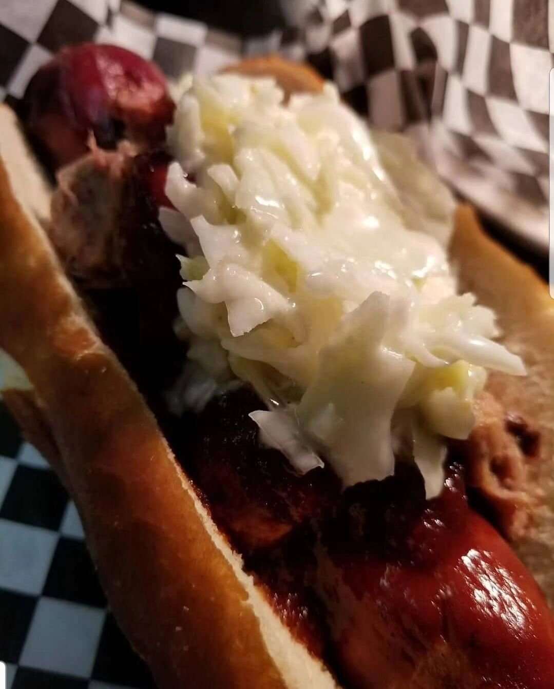 Top seller!  Carolinawurst: bacon cheddar jalapeno stuffed wurst topped with slow roasted pulled pork, hausmade cherry chipotle BBQ sauce and crisp cole slaw available in haus or online for pickup or delivery at 11am daily! #bratsburgerbier #dinein #