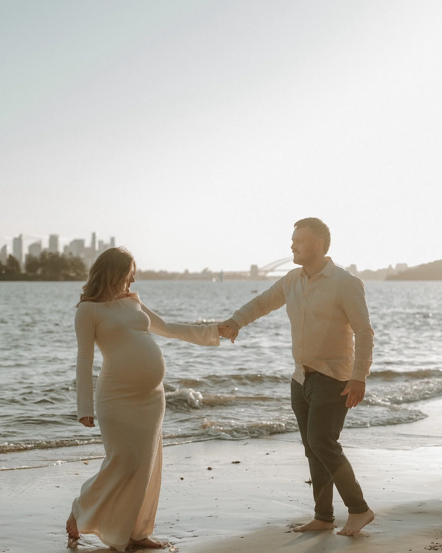 The sand was cool beneath your feet, the tide rolling in a little closer with every wave as you leaned into each other, swaying slowly to no music at all. The sunset painted everything in soft amber light, and for once, there was nothing else to do b