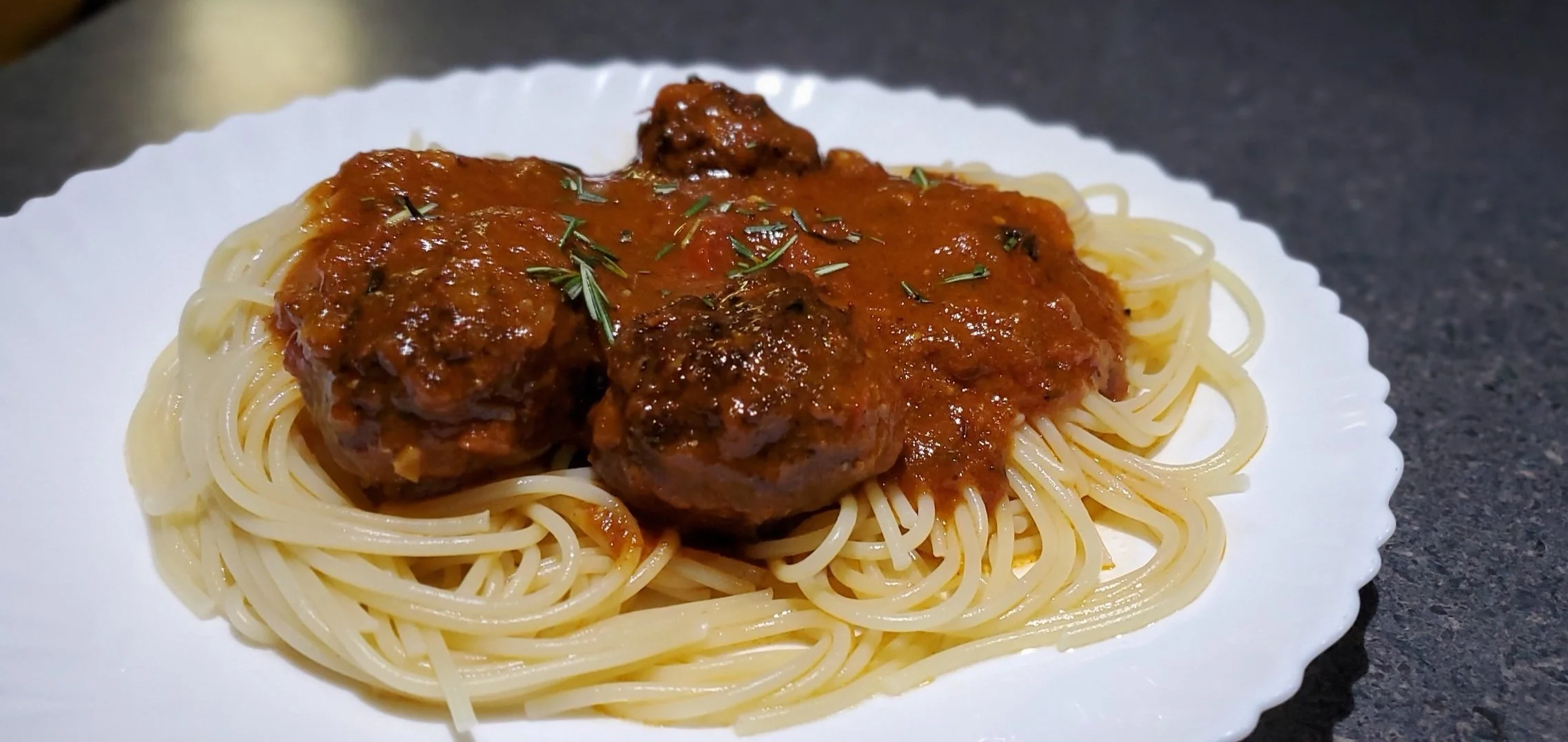 Spaghetti with a basil marinara and rosemary.