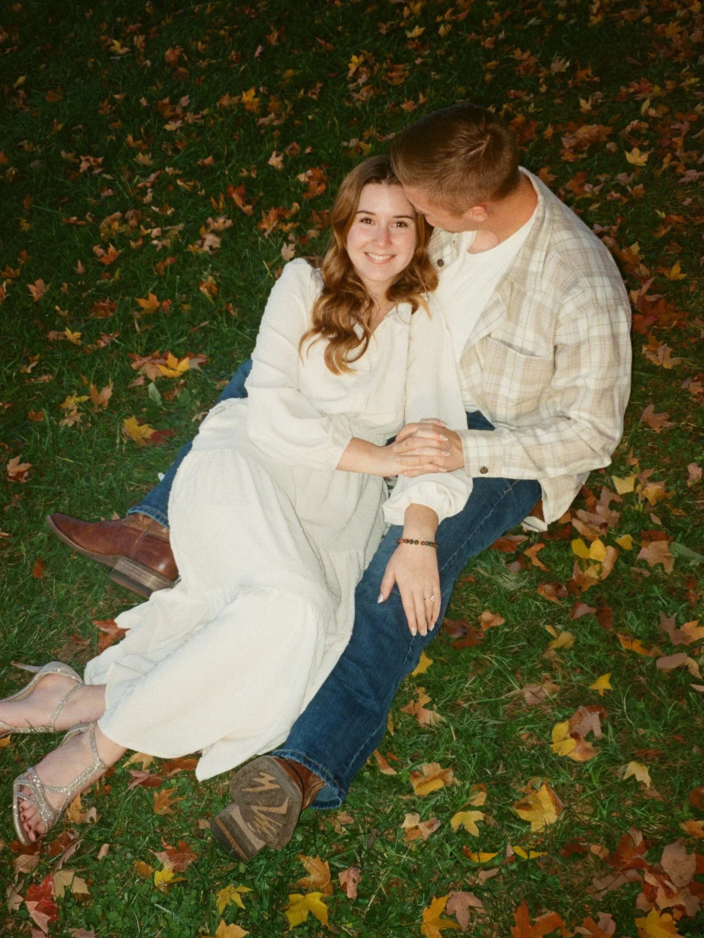 Film has a way of softening the world &mdash;
of holding a moment exactly where the heart lingers.

This frame is about love that doesn&rsquo;t need to be loud.
It whispers.
It rests gently in an autumn breeze, in a forehead kiss, in the safety of be