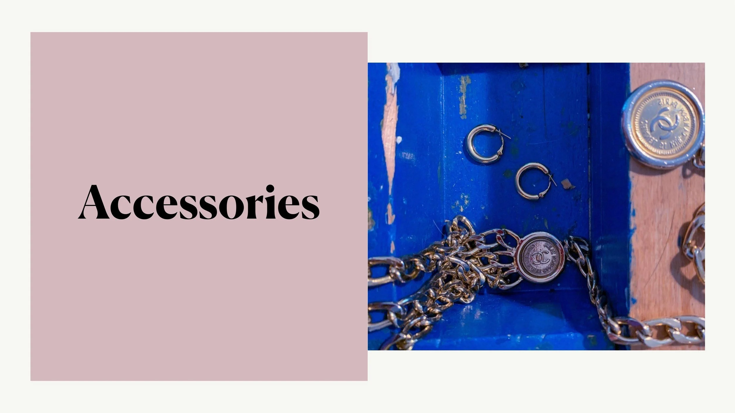 Accessories - chapter opener. Gold hoop earrings and a Chanel chain belt with CC medallions laid on cobalt blue painted wood.