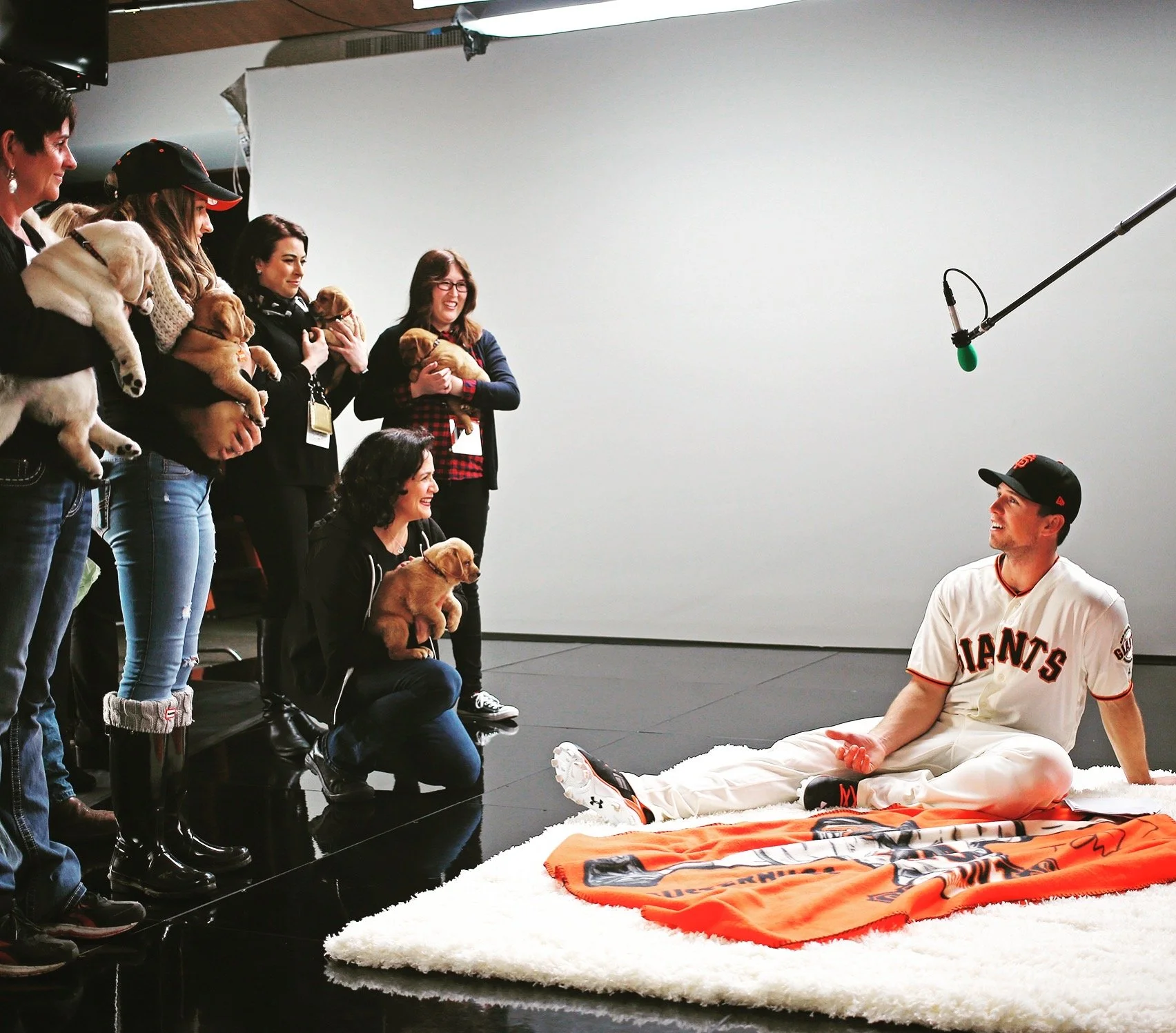 On a shoot with Buster Posey (and puppies!)