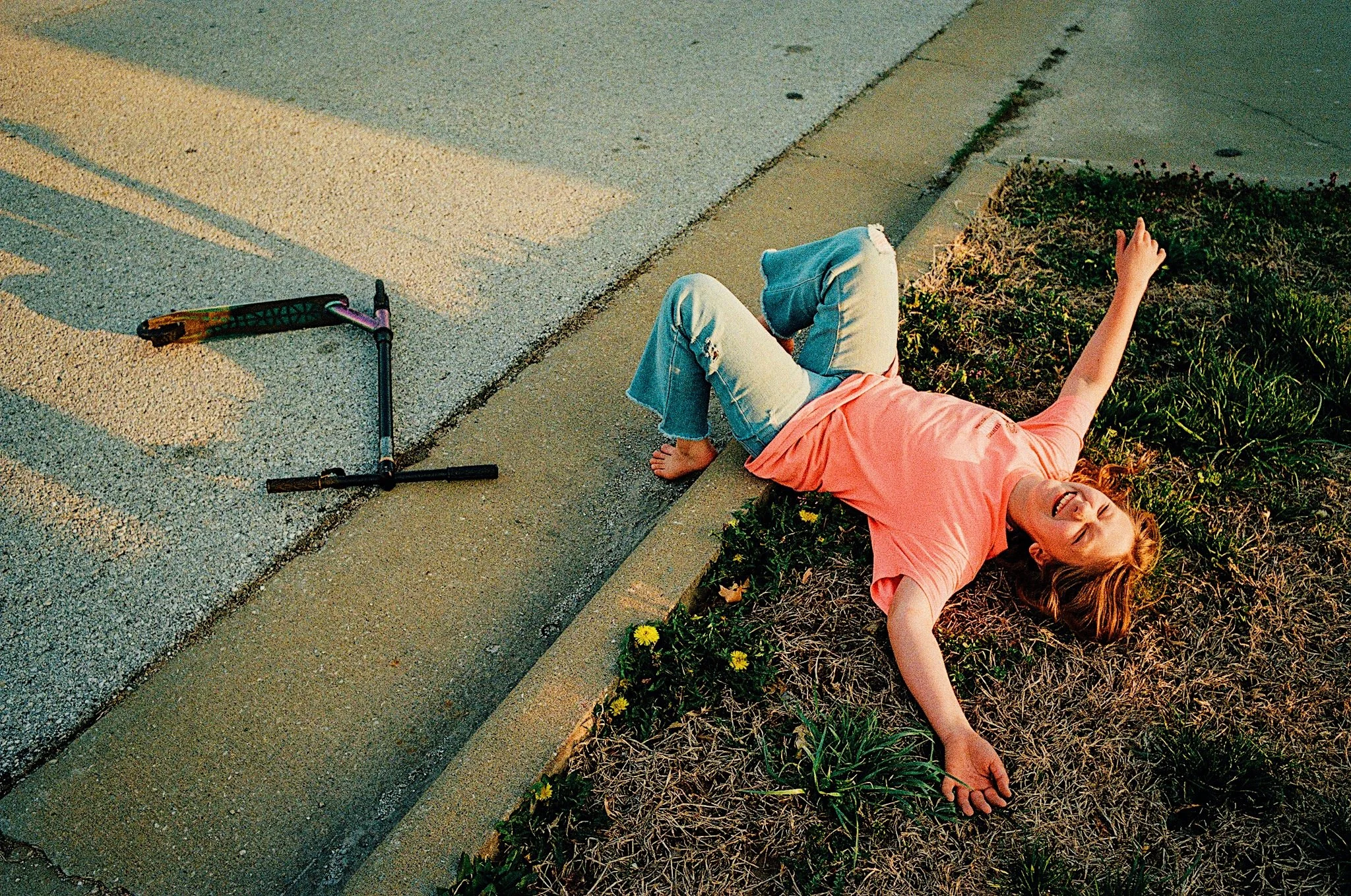 Sister playing in the driveway. From Dean Hinnant’s Blood series exploring siblinghood and family bonds