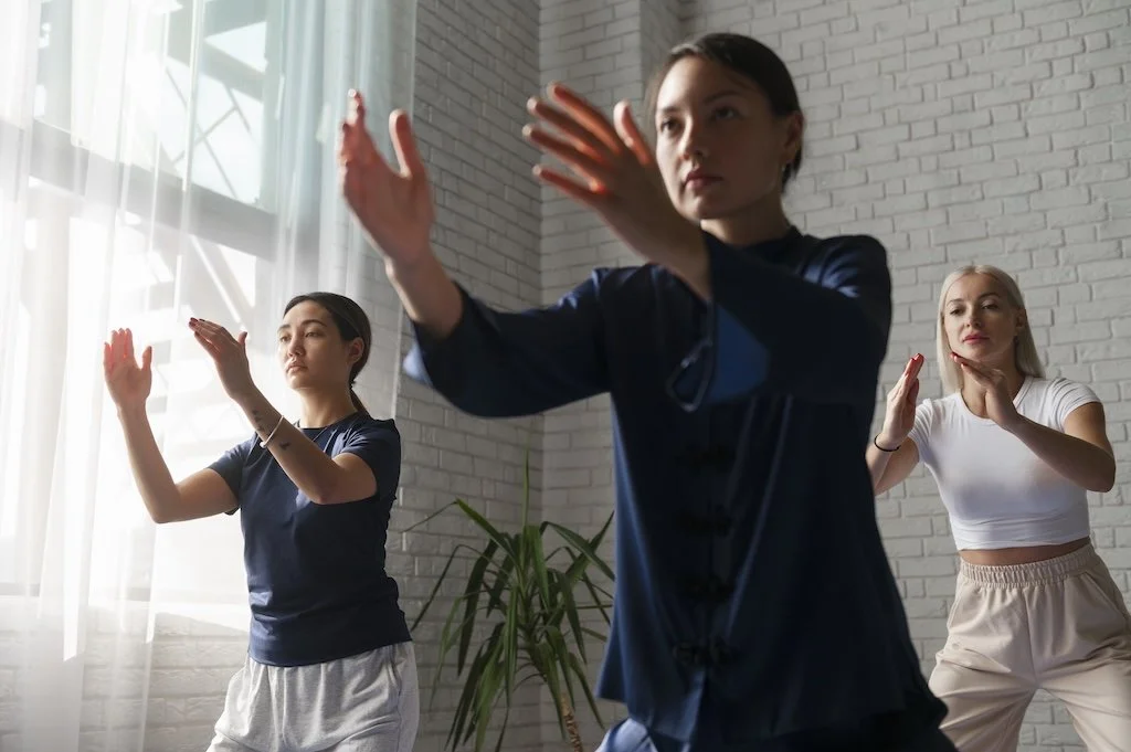 medium-shot-women-practising-tai-chi.jpg