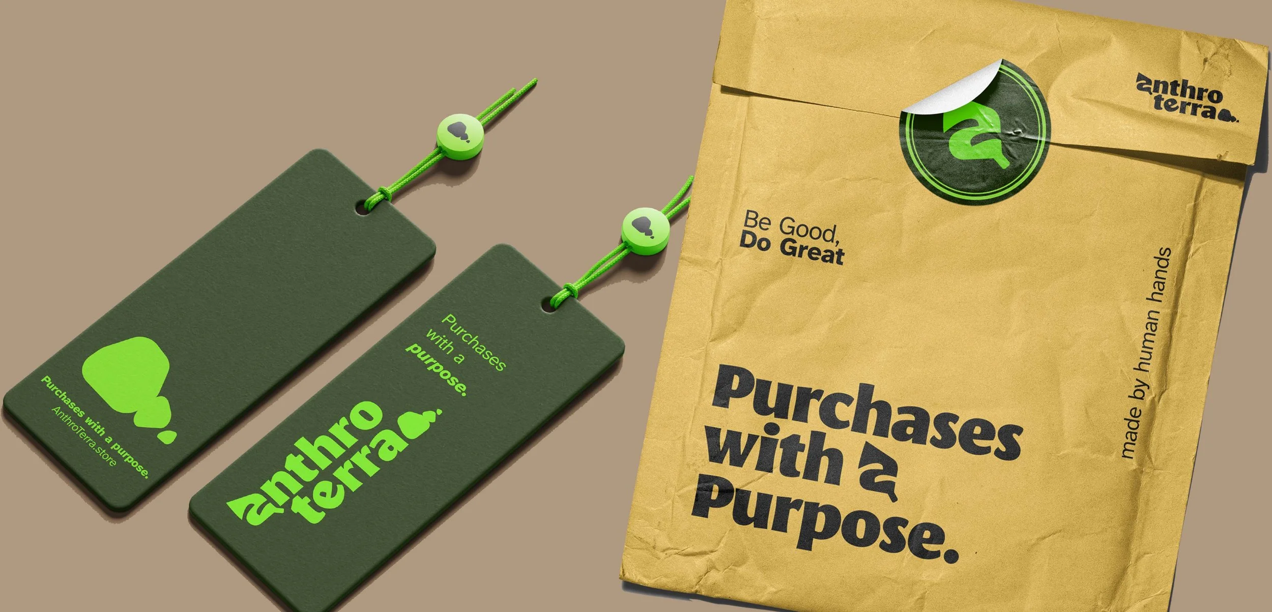 Green tags with black text reading "Purchases with a purpose" and "Purchases with a purpose" attached with green strings featuring small round beads, alongside a crumpled brown paper bag labeled "anthro terra" with the slogan "Be Good, Do Great" and the phrase "made by human hands."
