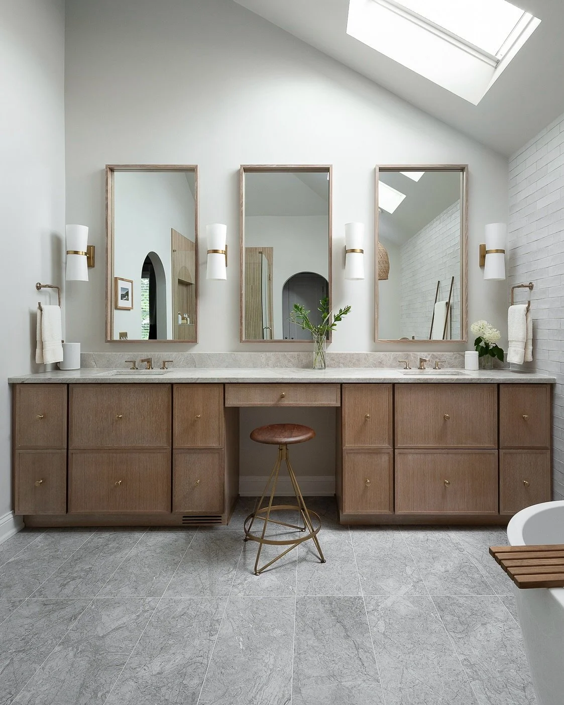When designing this bathroom remodel, I wanted to do 3 tall mirrors that take advantage of the vaulted ceiling. I scoured my sources but just couldn’t find the right size or style mirrors. So I used the cabinetry material and had custom mirrors