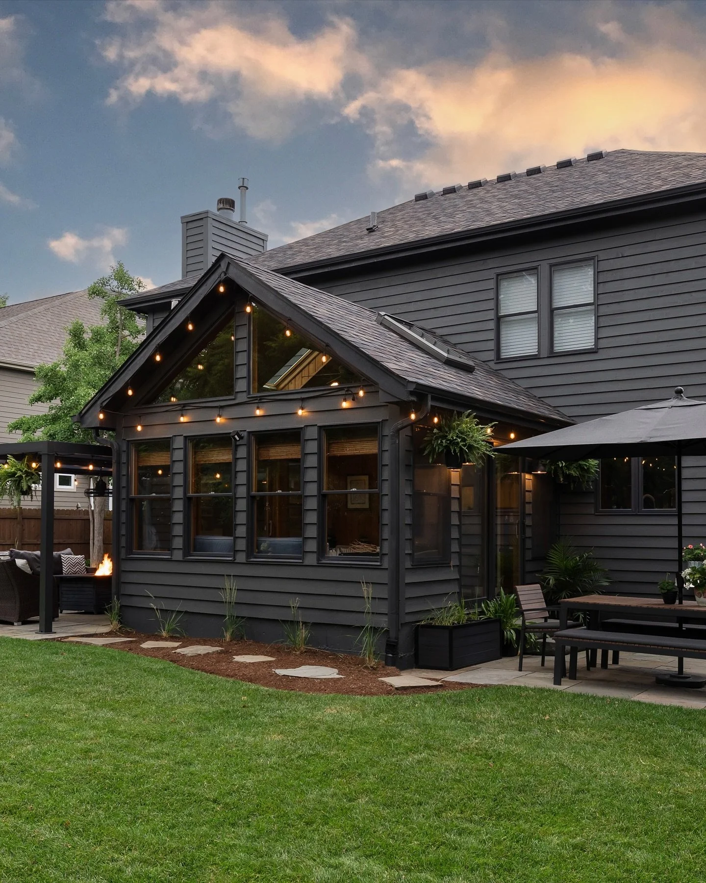 Keep the party going all season long with plenty of backyard places to hang out. 
#edcShiftingGears
Photos by @yandbinteriorsphotography 
#hellofall #autmn #exteriordesign #blackhouse #metalpergola #bluestonepatio #blacksable #ironore #blackmagic #