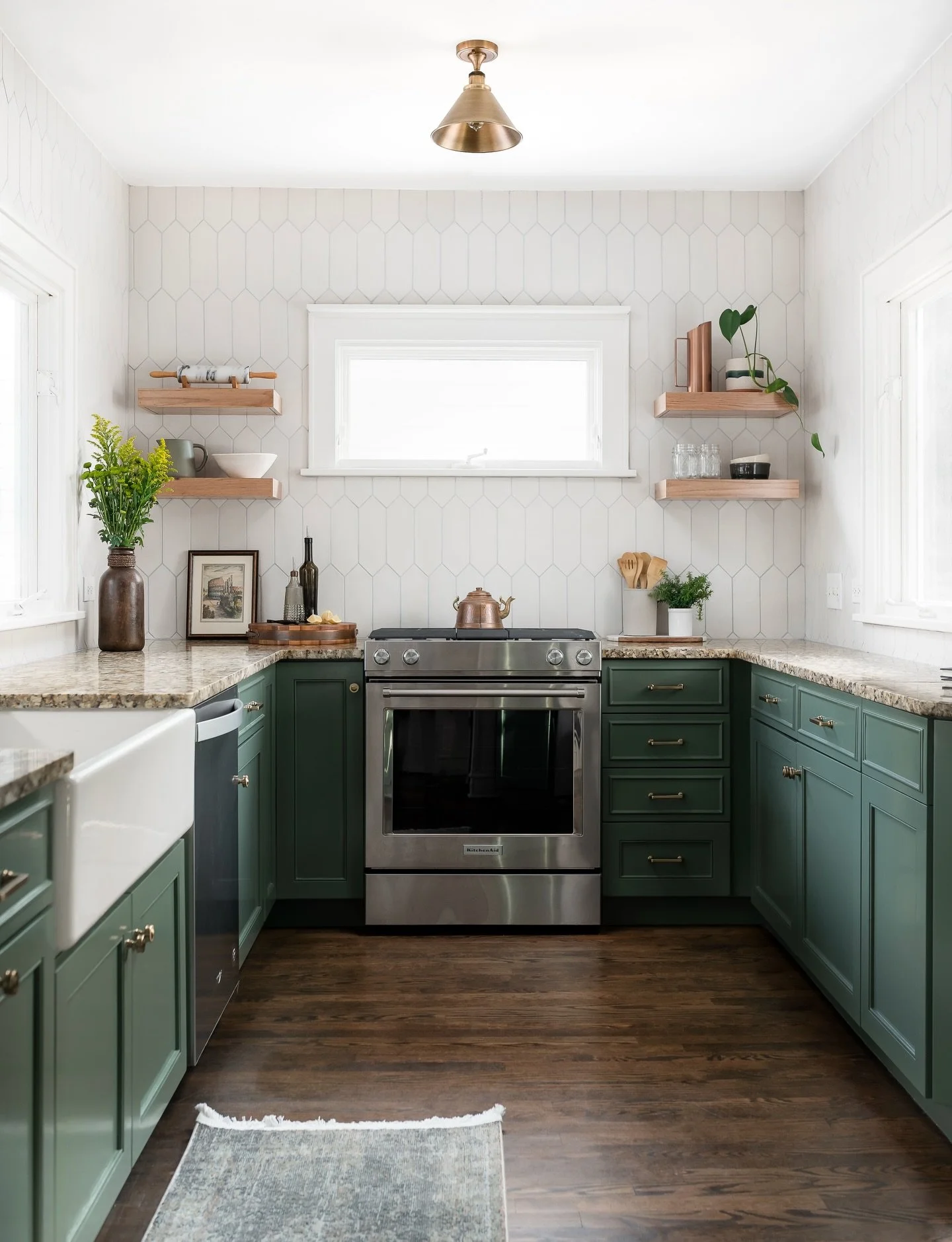 The cabinets as we found them were pretty much busted, with chipped paint and broken hinges everywhere. But they were still perfect candidates to be repaired and repainted, along with new hardware, tile, and lighting, to completely makeover this spac