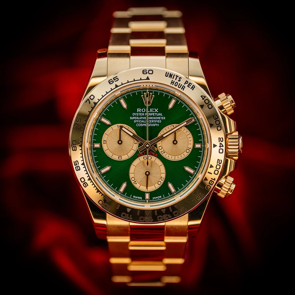 yellow gold green face daytona rolex