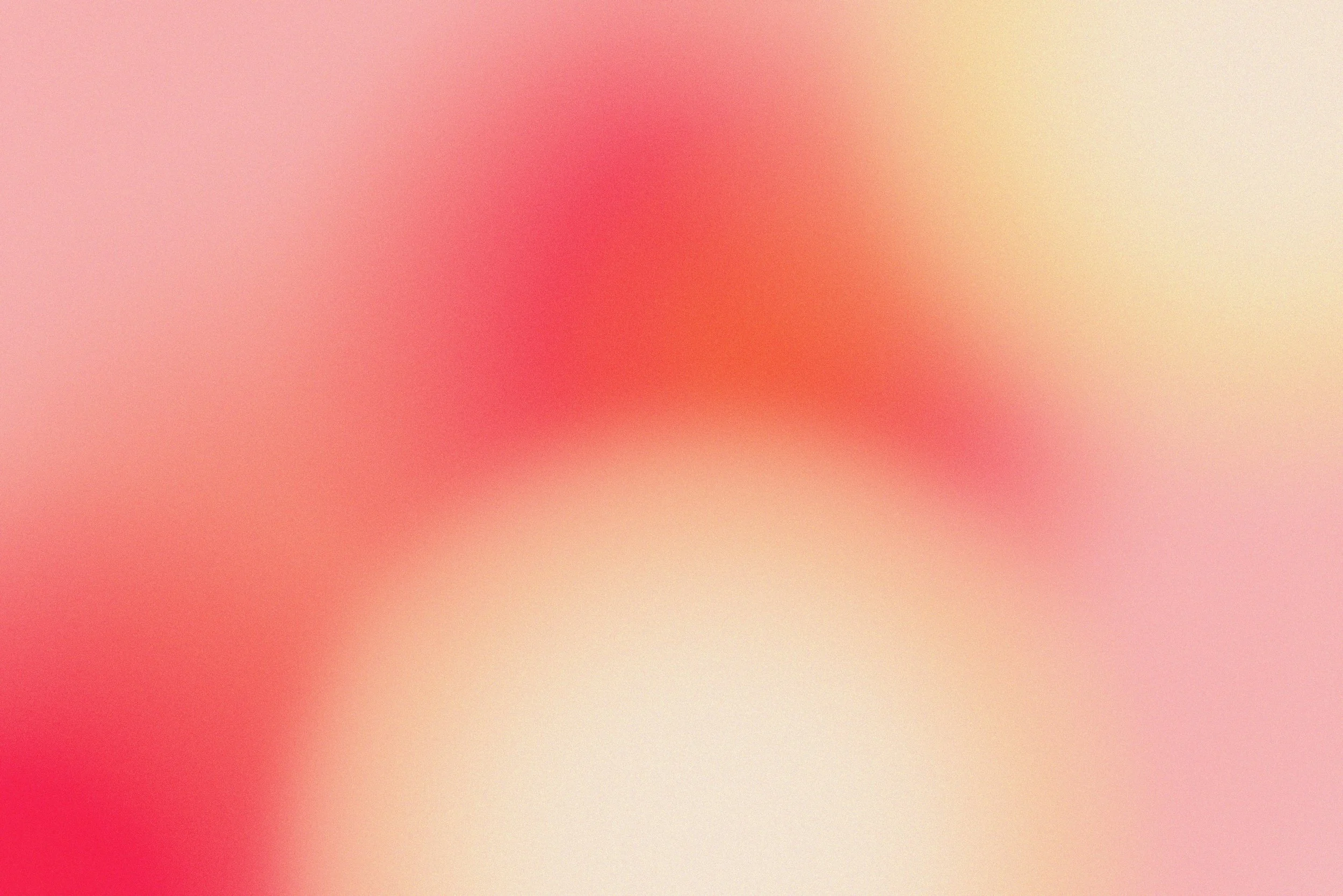 Blurred image with pink, red, and beige colors.