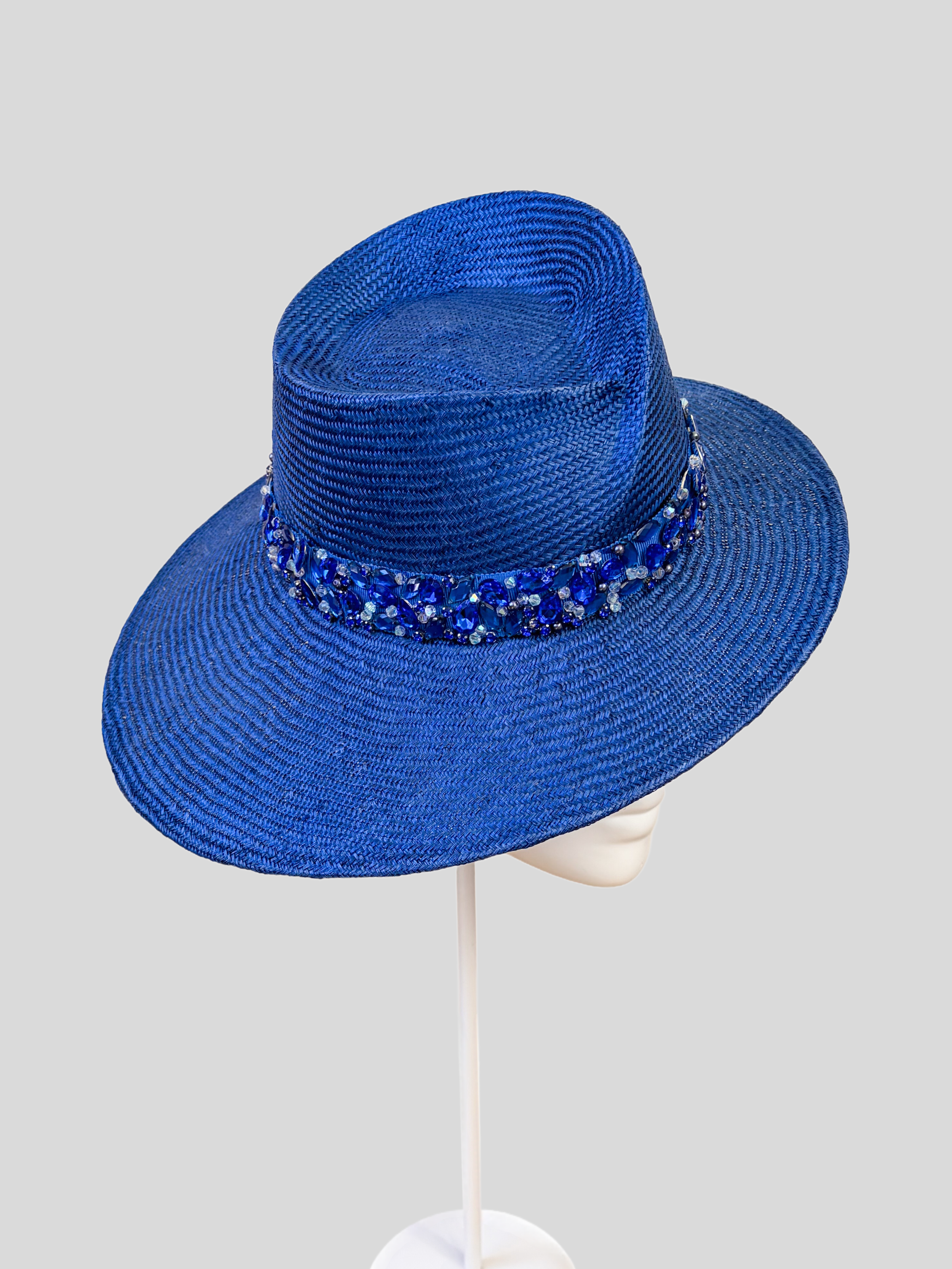 Close-up: Close-up of the hand-embellished blue beaded and crystal-style band on the MAISON Sapphire Parisisal fedora.