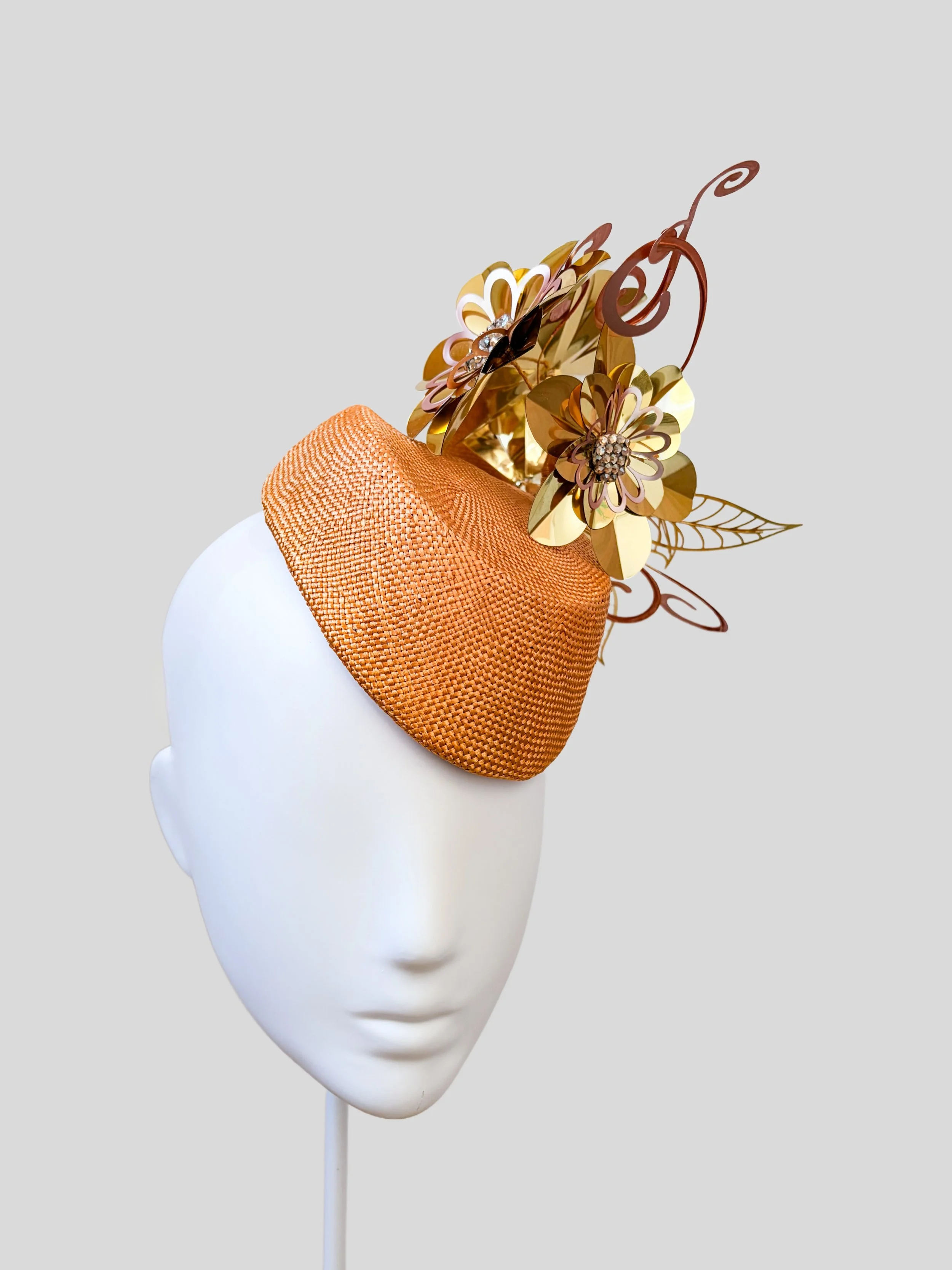 Left: Aurelia Gilded metallic floral headpiece shown from the left side.