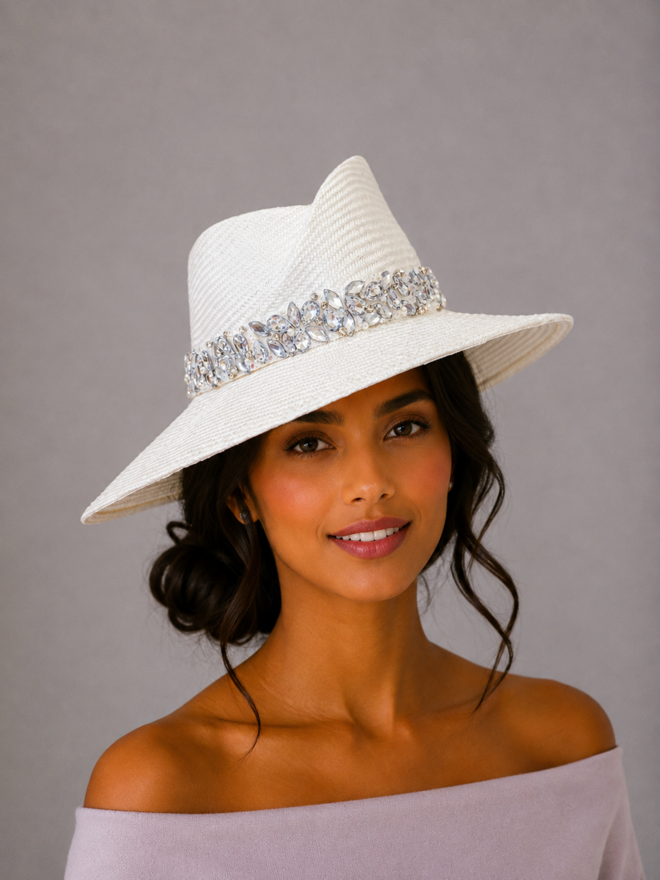 Model: MAISON Pearl Parisisal fedora styled on a model, showcasing the statement silhouette and hand-embellished silver band.