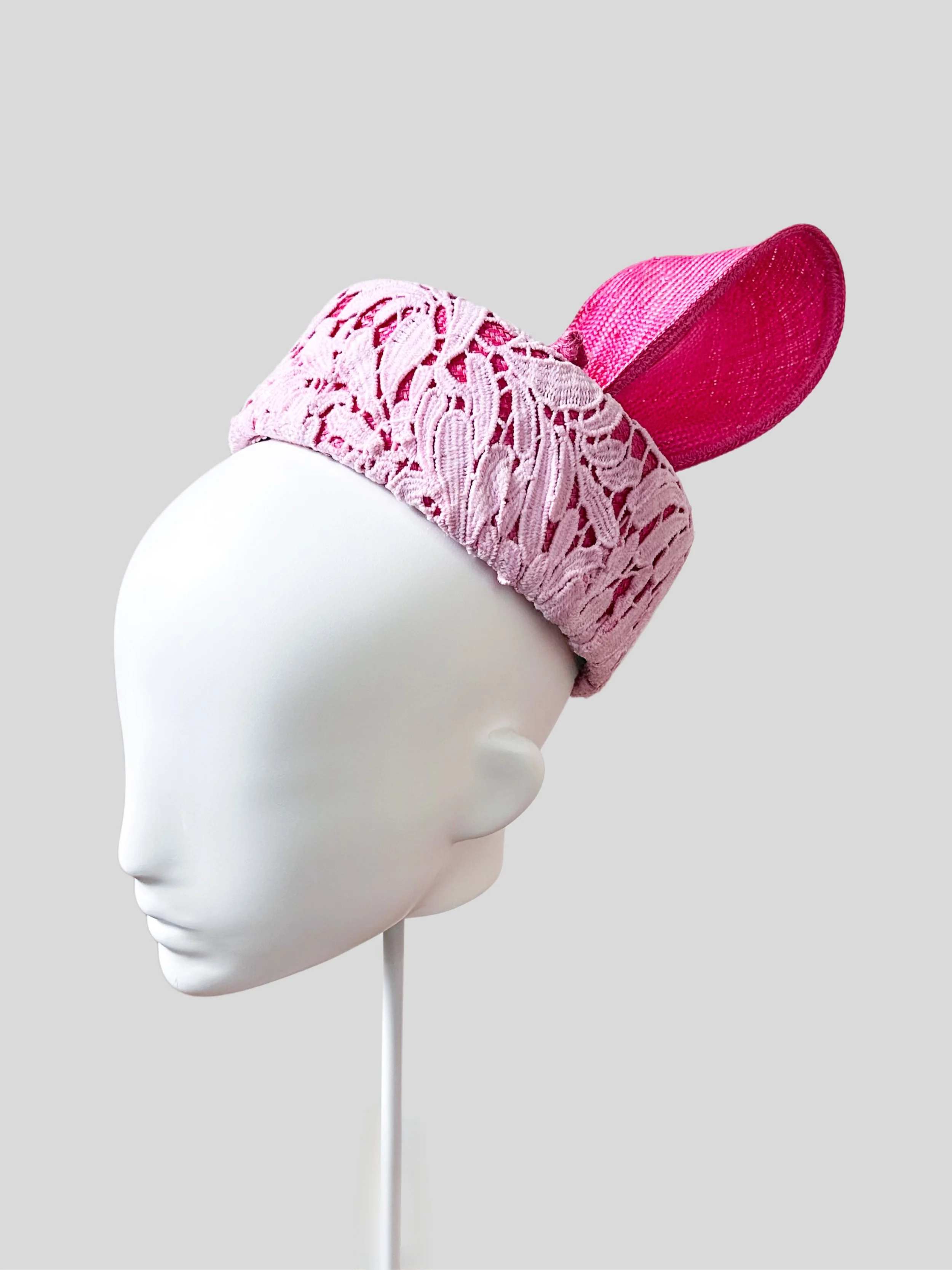 Right profile of the Ombre Lace Pillbox with Parisial Bow, illustrating the sleek lines and the striking ombre pink wired bow from this angle.