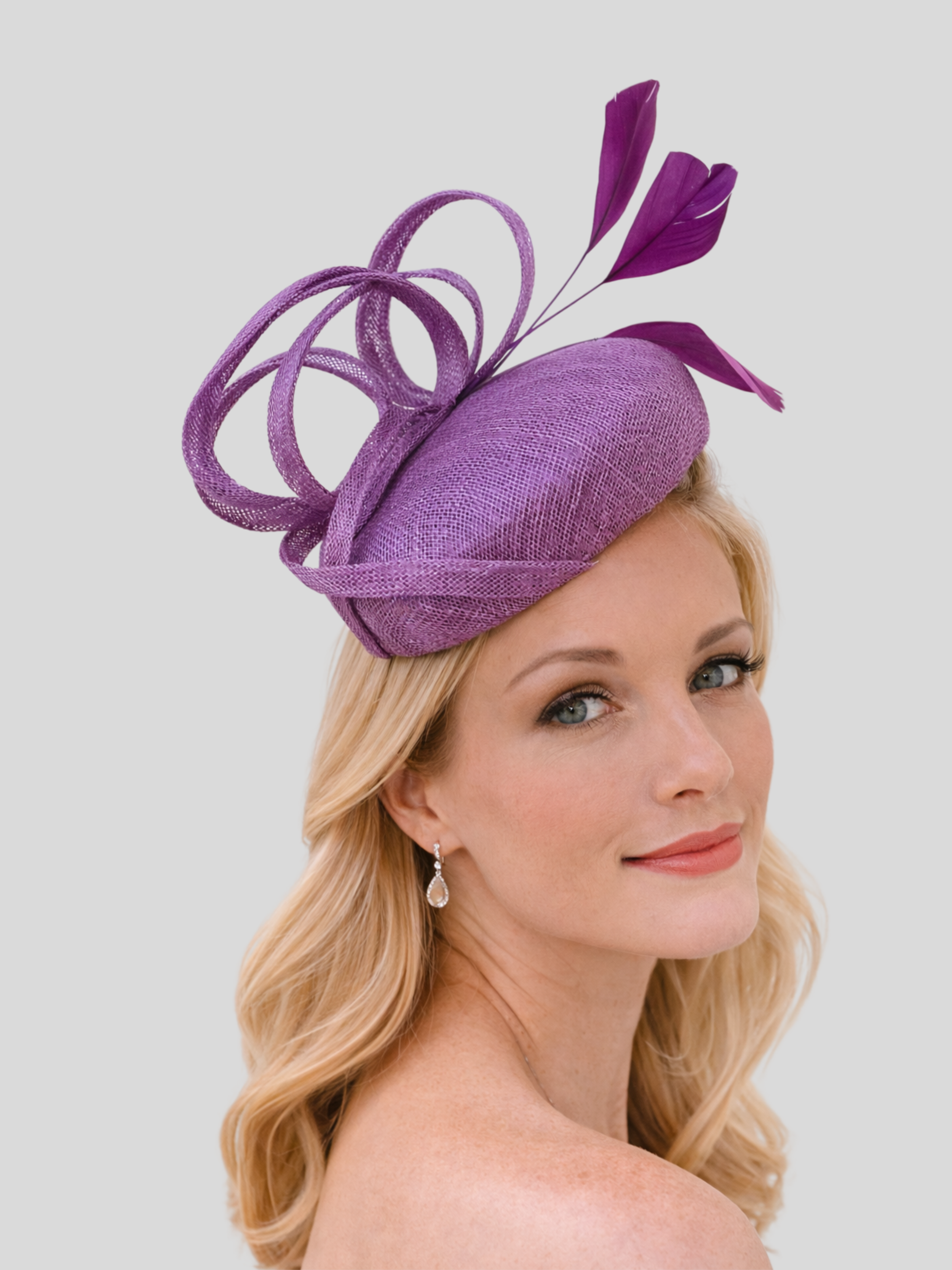 abril-sinamay-cocktail-hat-lilac-purple-model-view.png