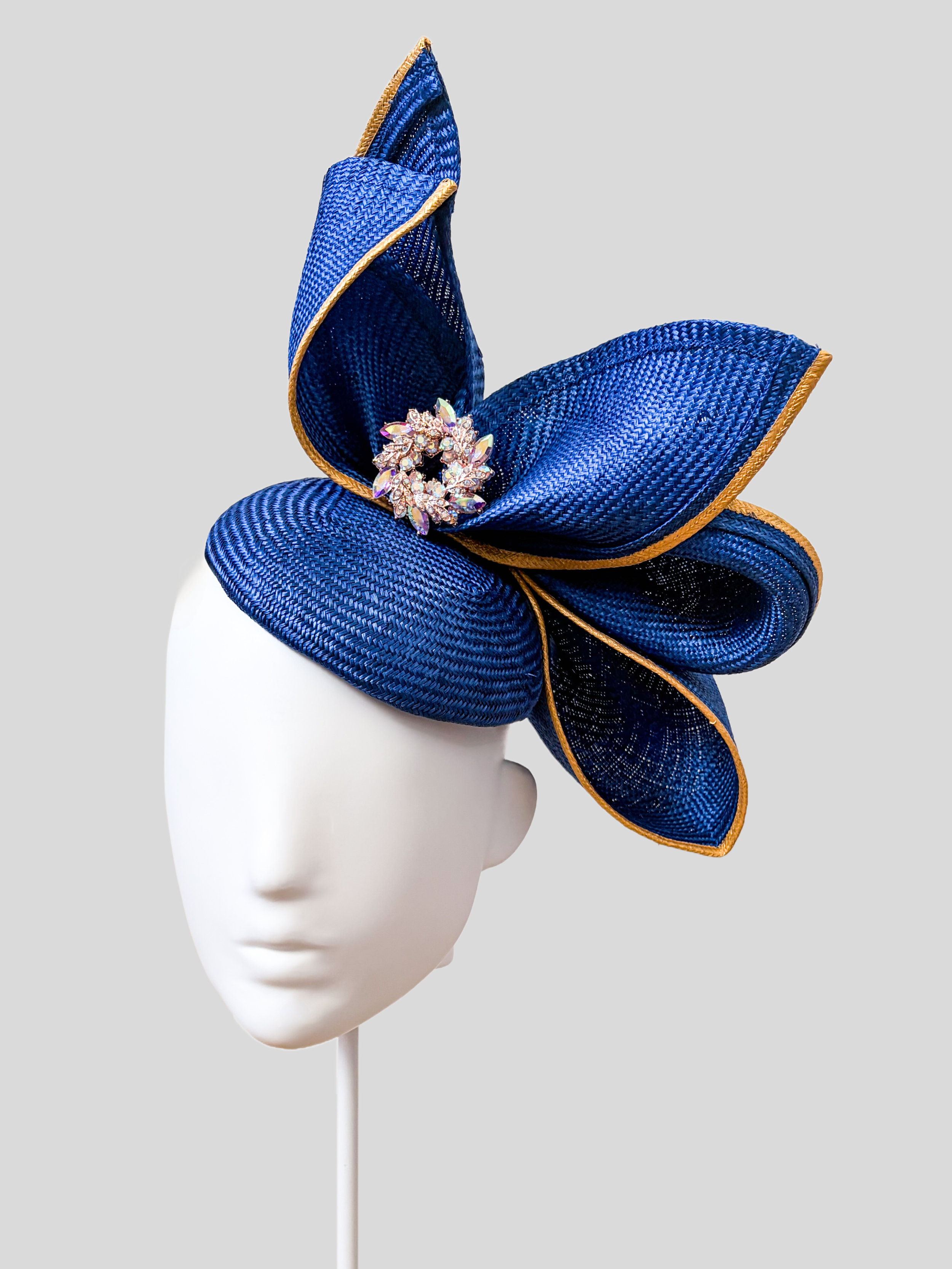 Aria Cobalt sculptural Parisisal headpiece in deep blue with metallic gold edging and pearl embellishment.