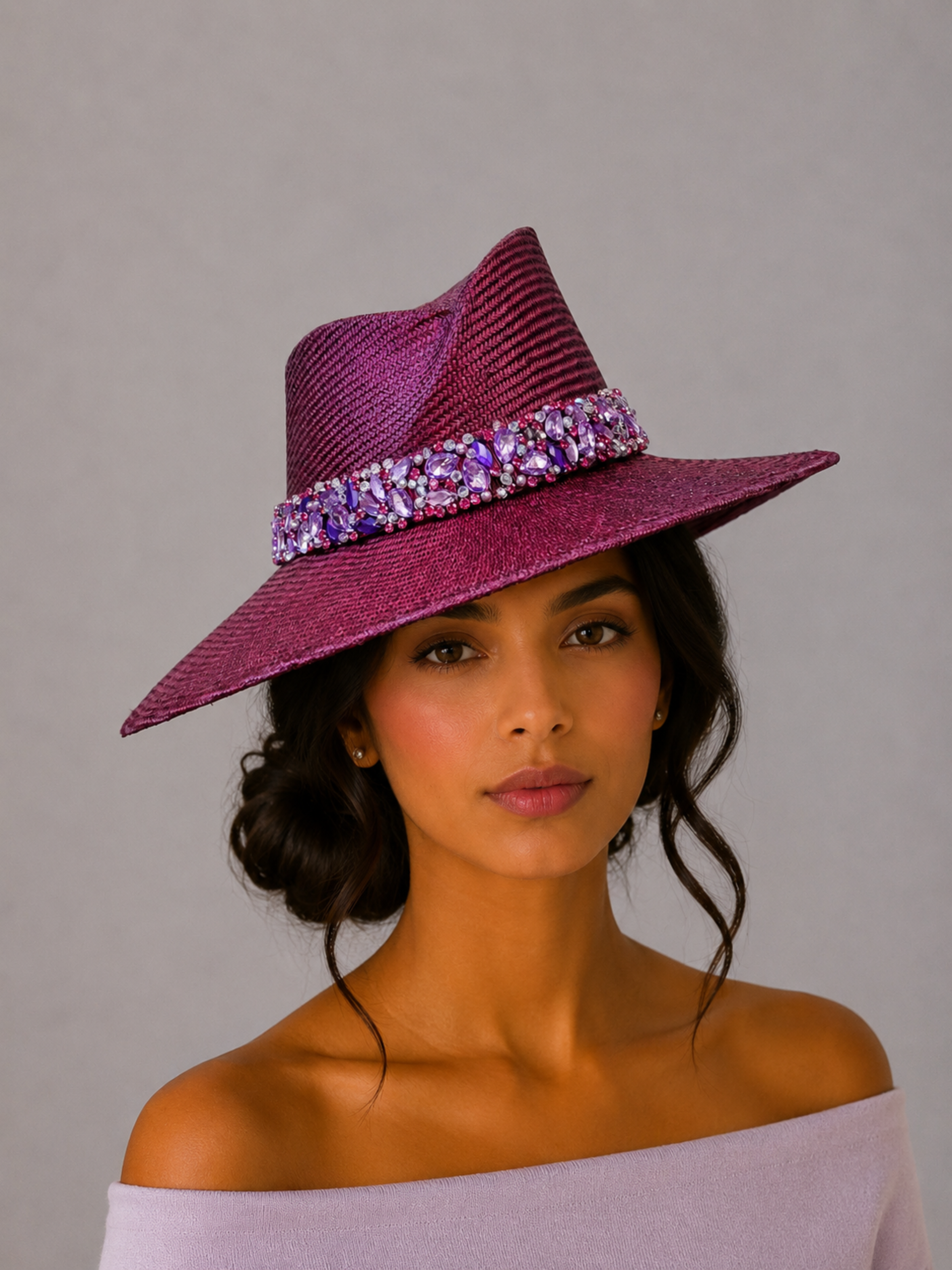 Model: MAISON Amethyst Parisisal fedora styled on a model, showcasing the statement silhouette and hand-embellished purple band.