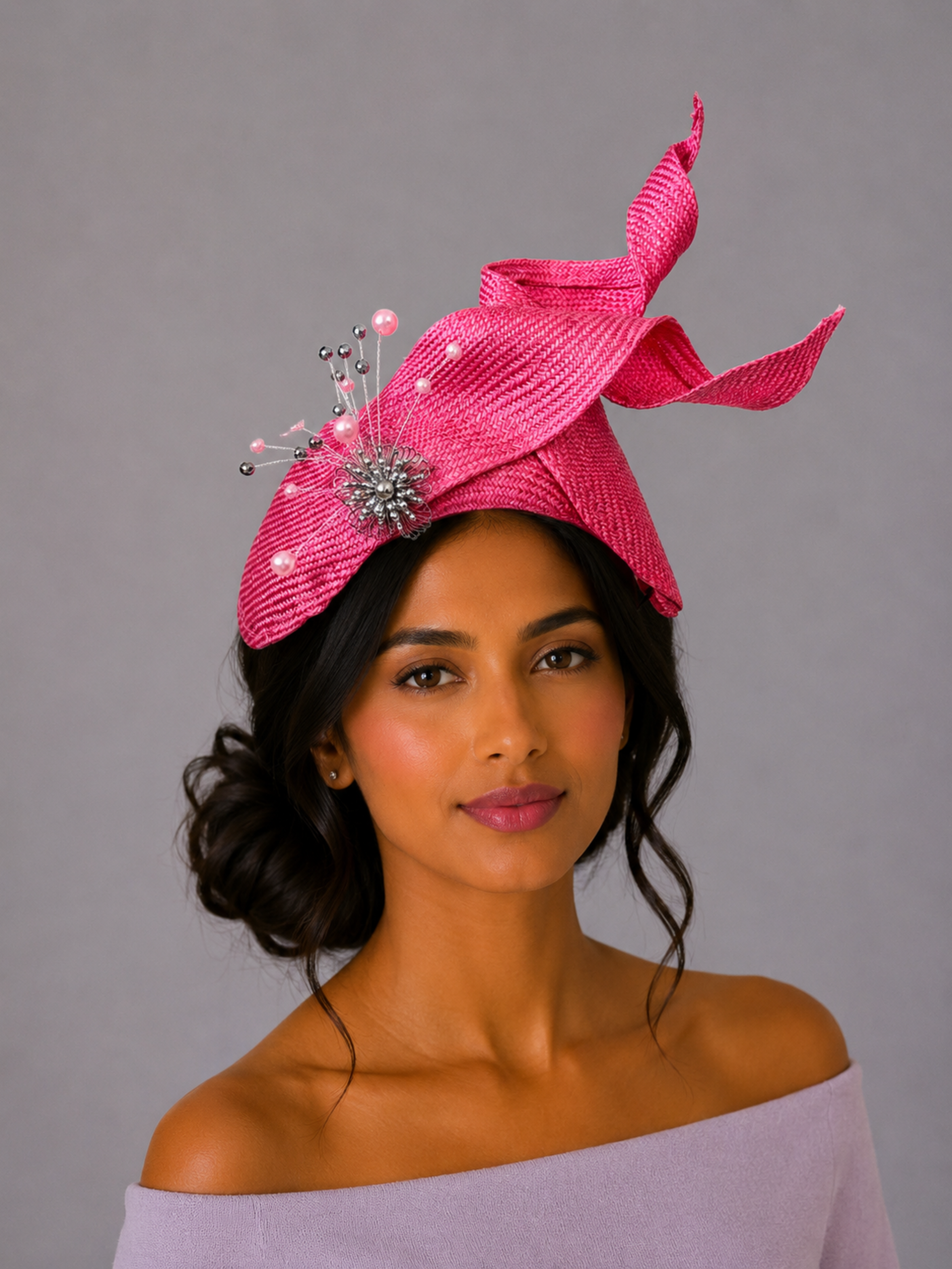 Model: SÉLÈNE Rose Parisisal bandeau headband styled on a model, showcasing its sculptural profile and silver embellishment.