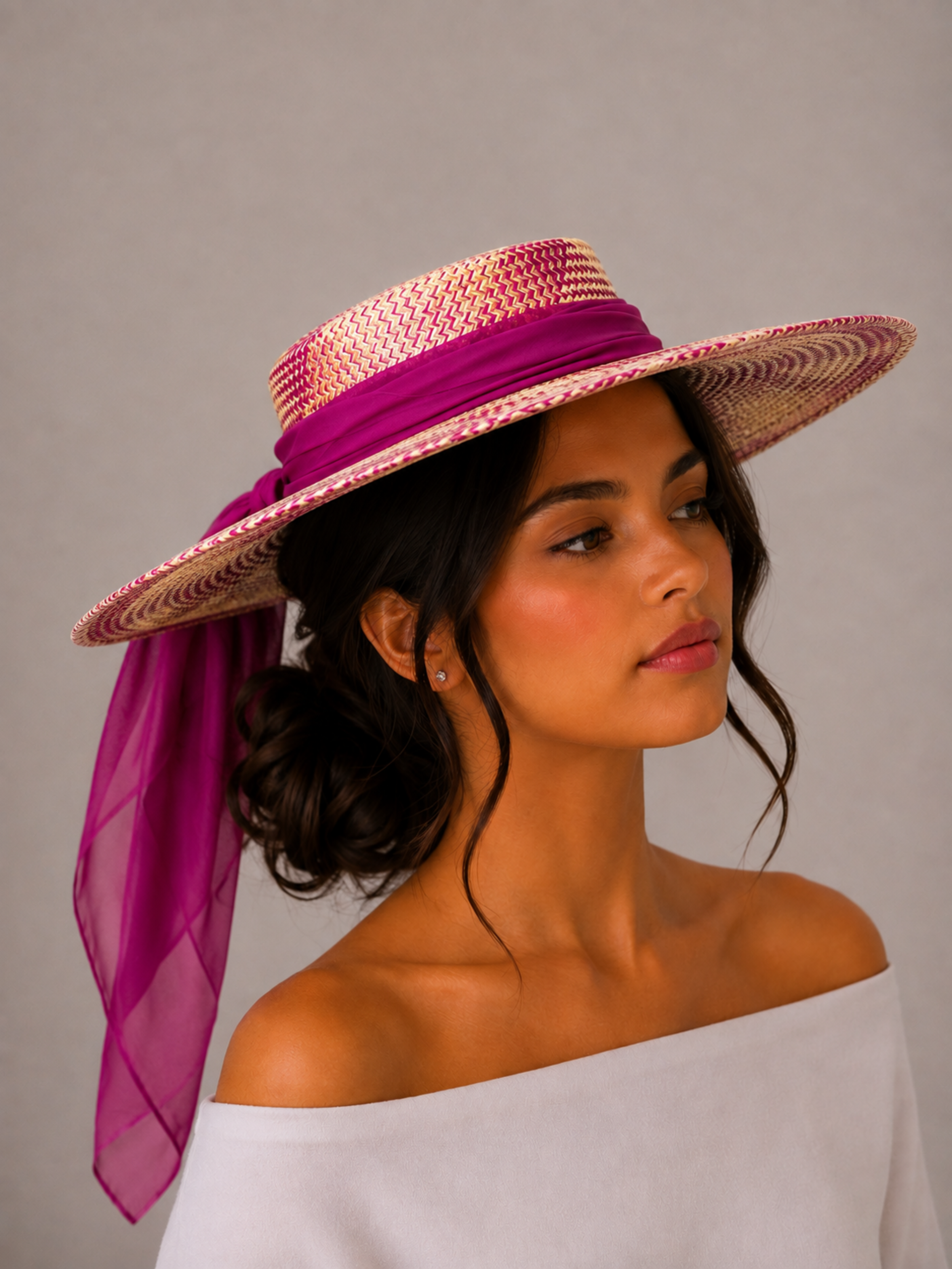 Solara Fuchsia woven boater hat styled on a model with a flowing rose-purple silk chiffon tie.