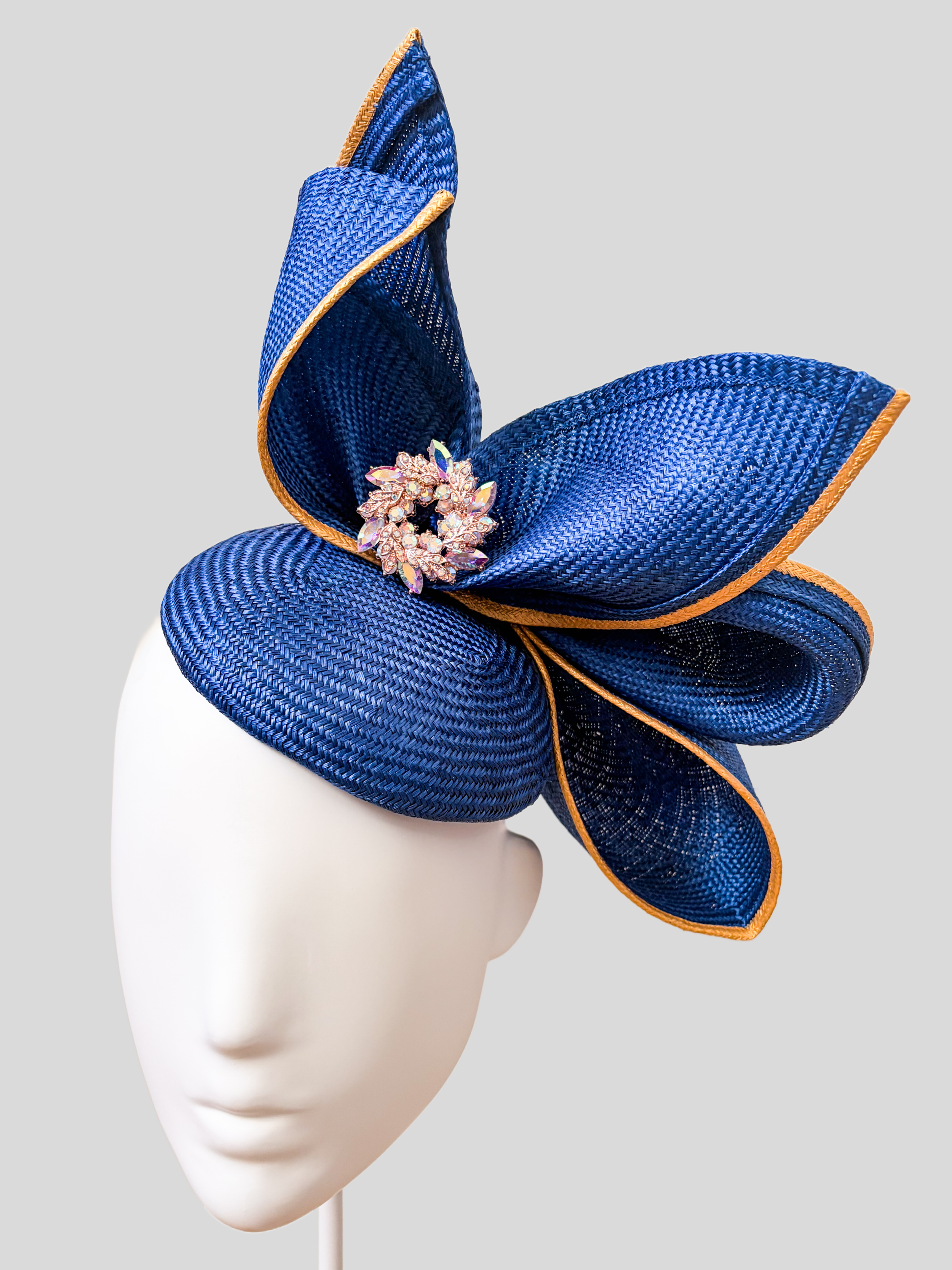 Close-up of Aria Cobalt metallic Parisisal straw, gold edging and pearl and crystal detailing.