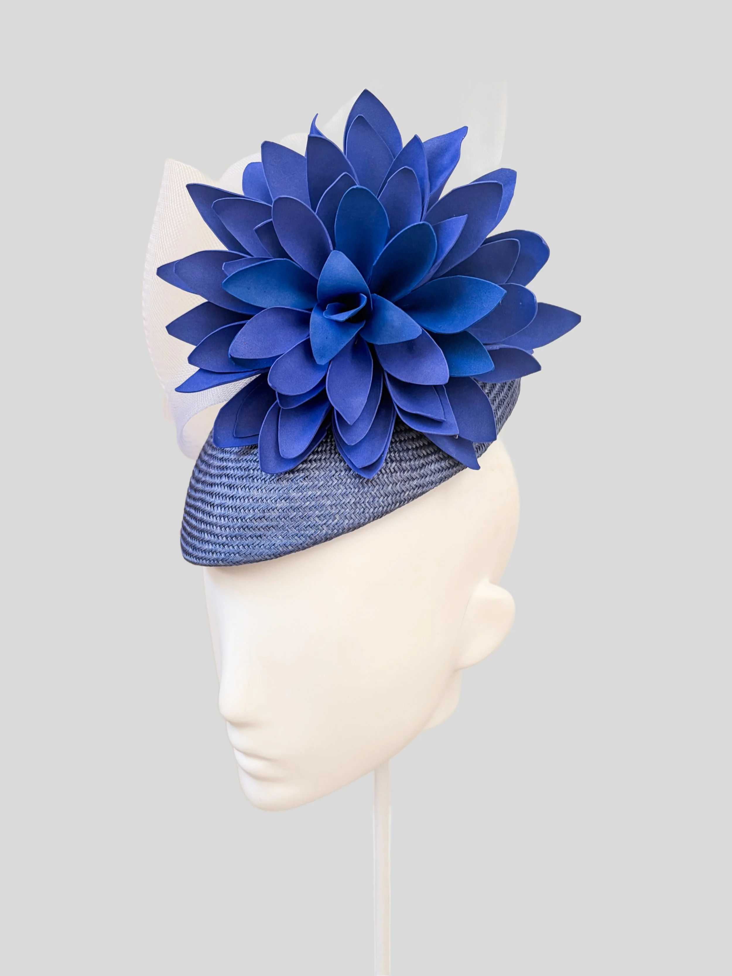 Alternative side view of PETALIA Blue, highlighting the lightweight floral embellishment and white crinoline.