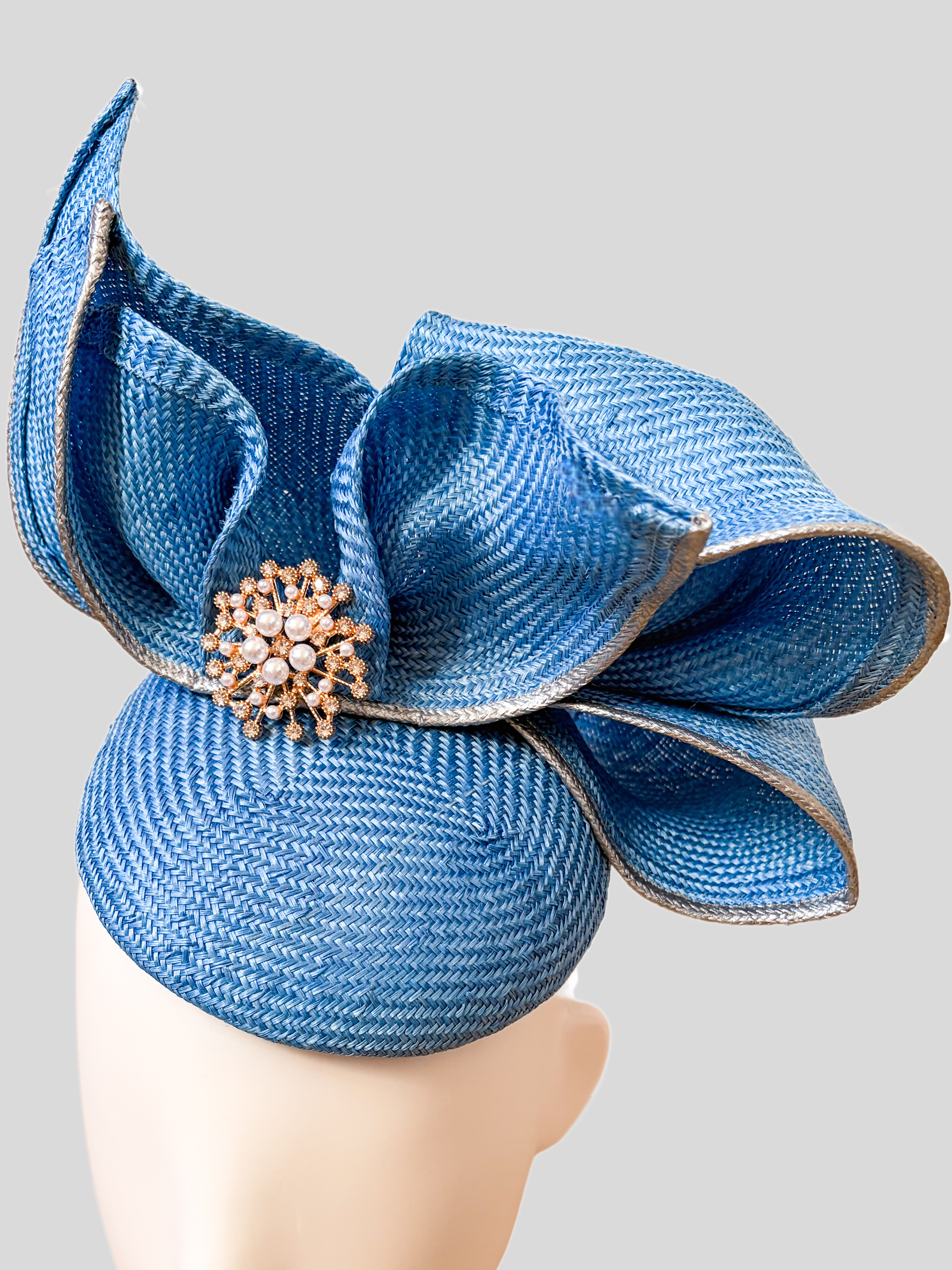 aria-sapphire-sculptural-parisisal-headpiece-close-up.png