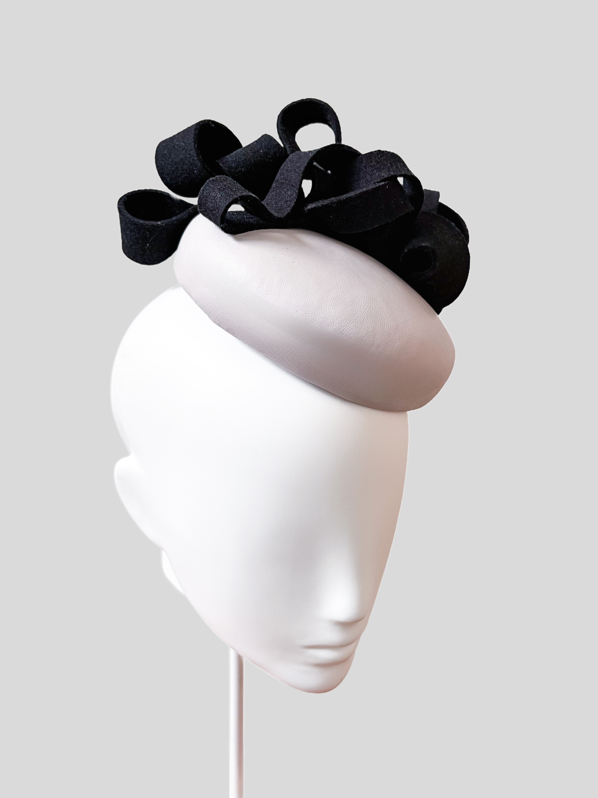 chiara-black-wool-felt-grey-leather-fascinator-left-view.jpg.png