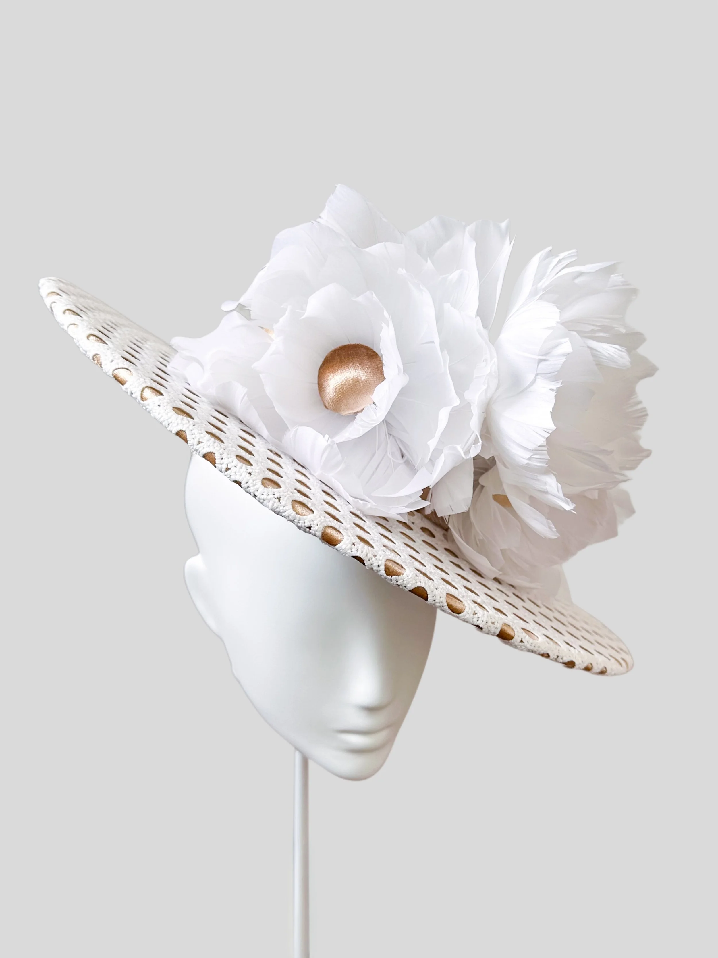 View of the Perles Roses hat from the left side, highlighting its chic angle across the face and the handbeaded pearl details. A glamorous side profile.