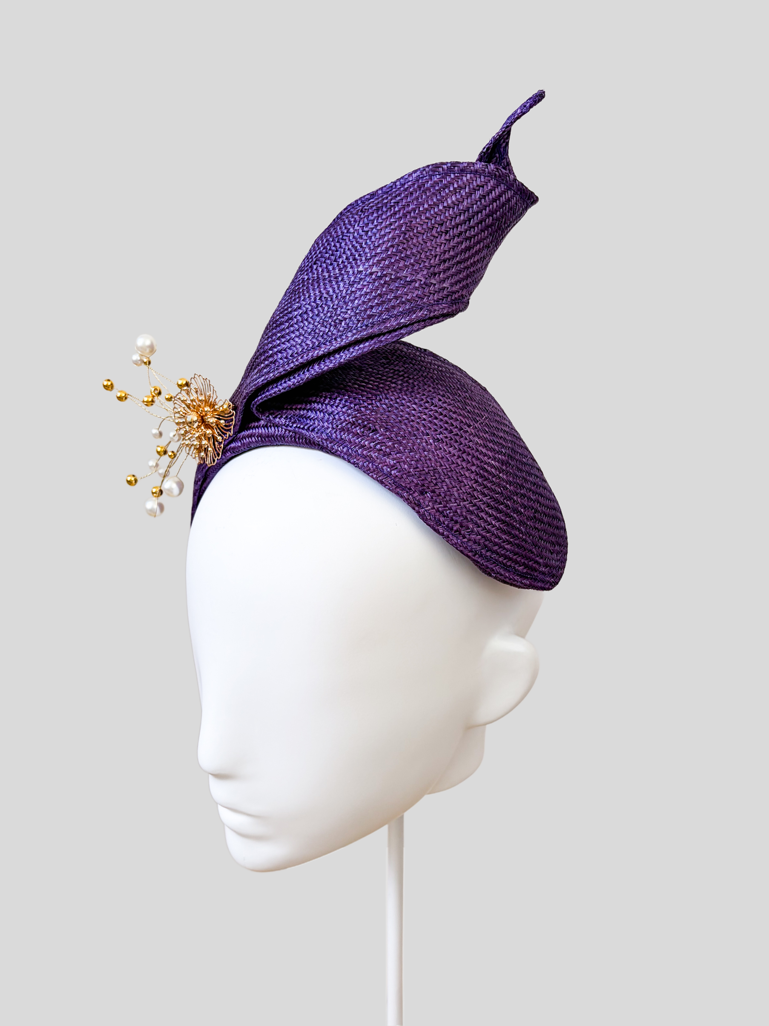 Right: Right-side view of the SÉLÈNE Amethyst Parisisal bandeau headband highlighting its rich purple finish and gold embellishment.