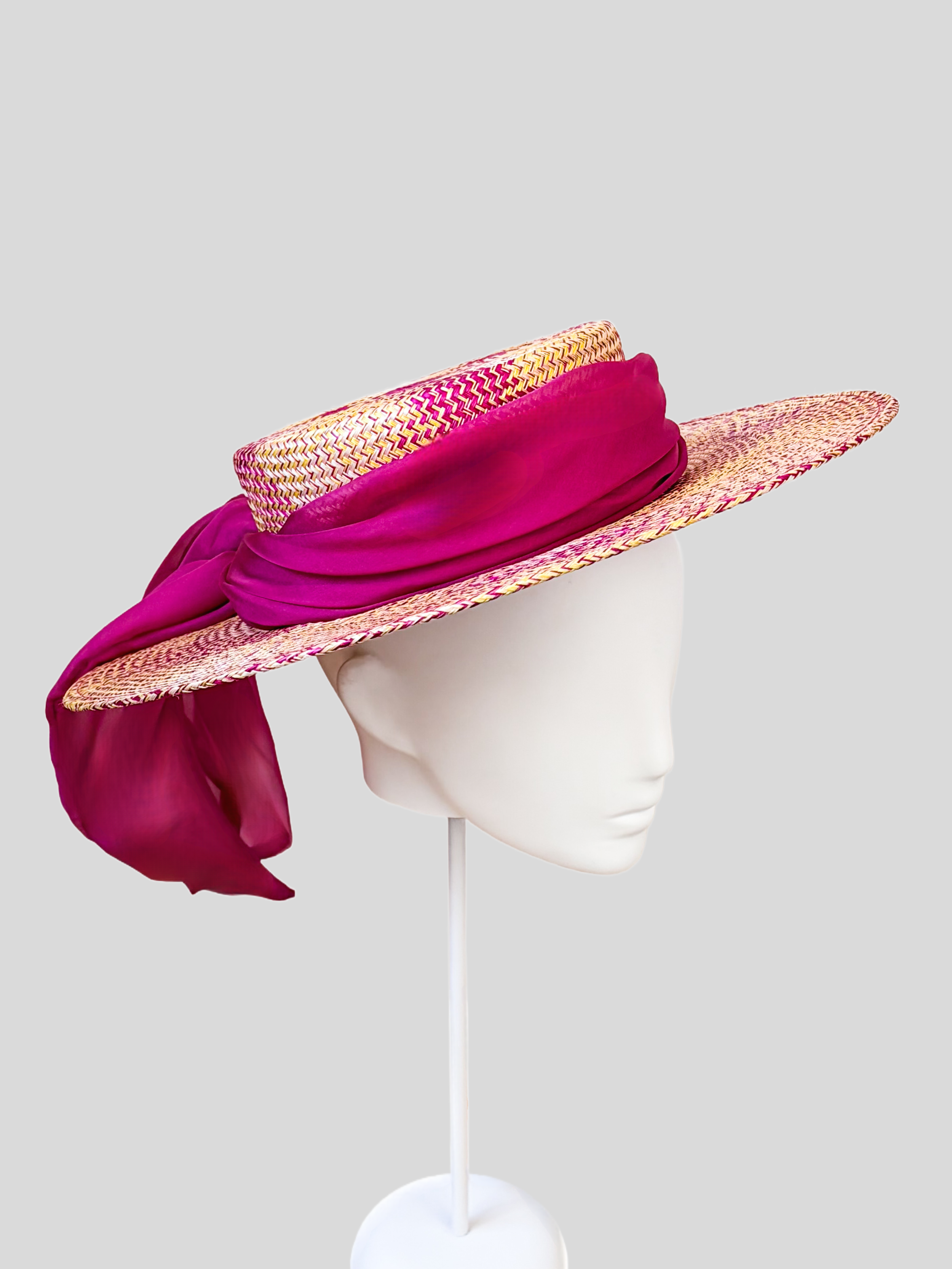 Solara Fuchsia woven boater hat shown from the left side.
