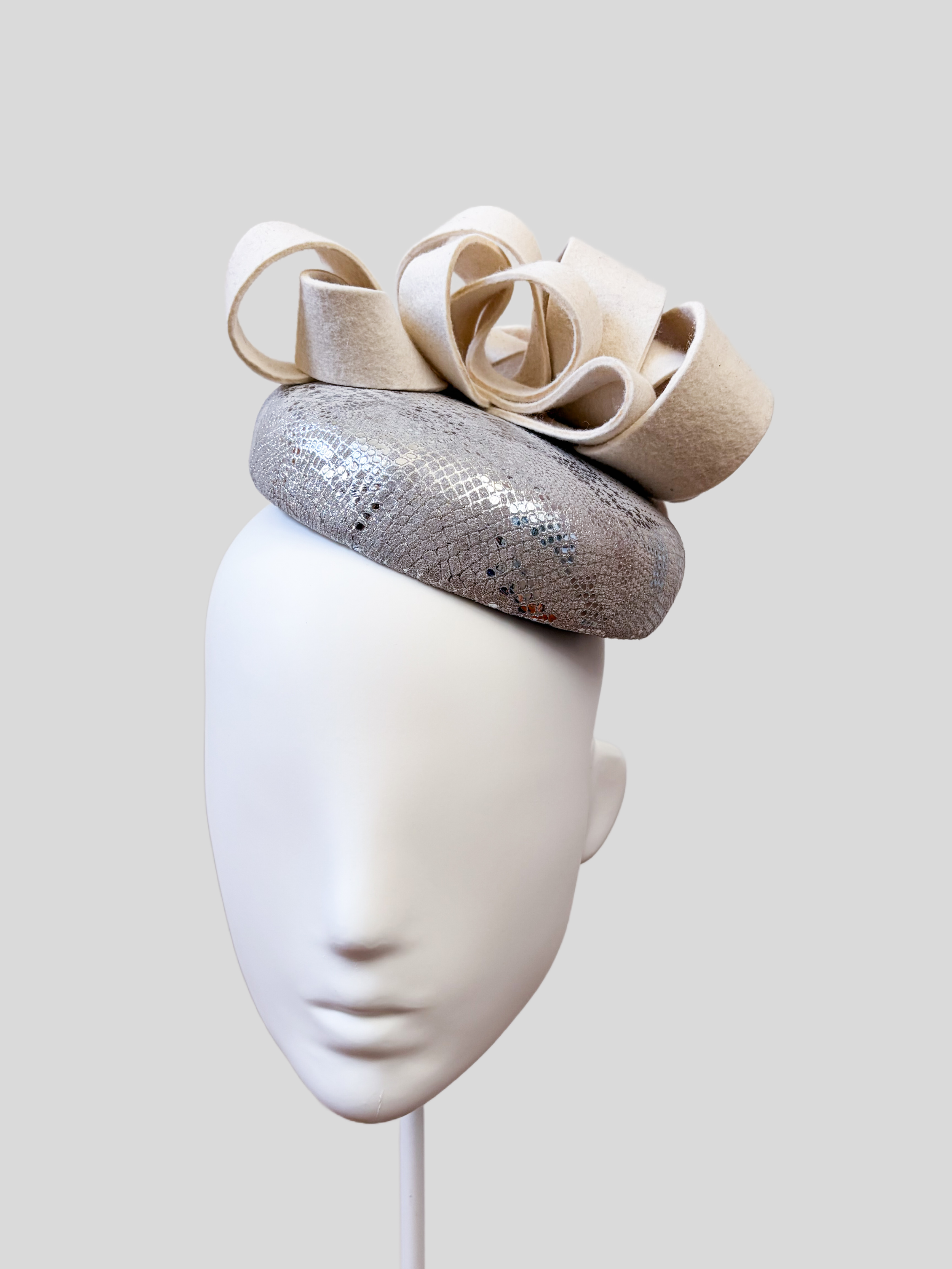 chiara-silver-white-wool-felt--leather-fascinator-front-view.jpg.png
