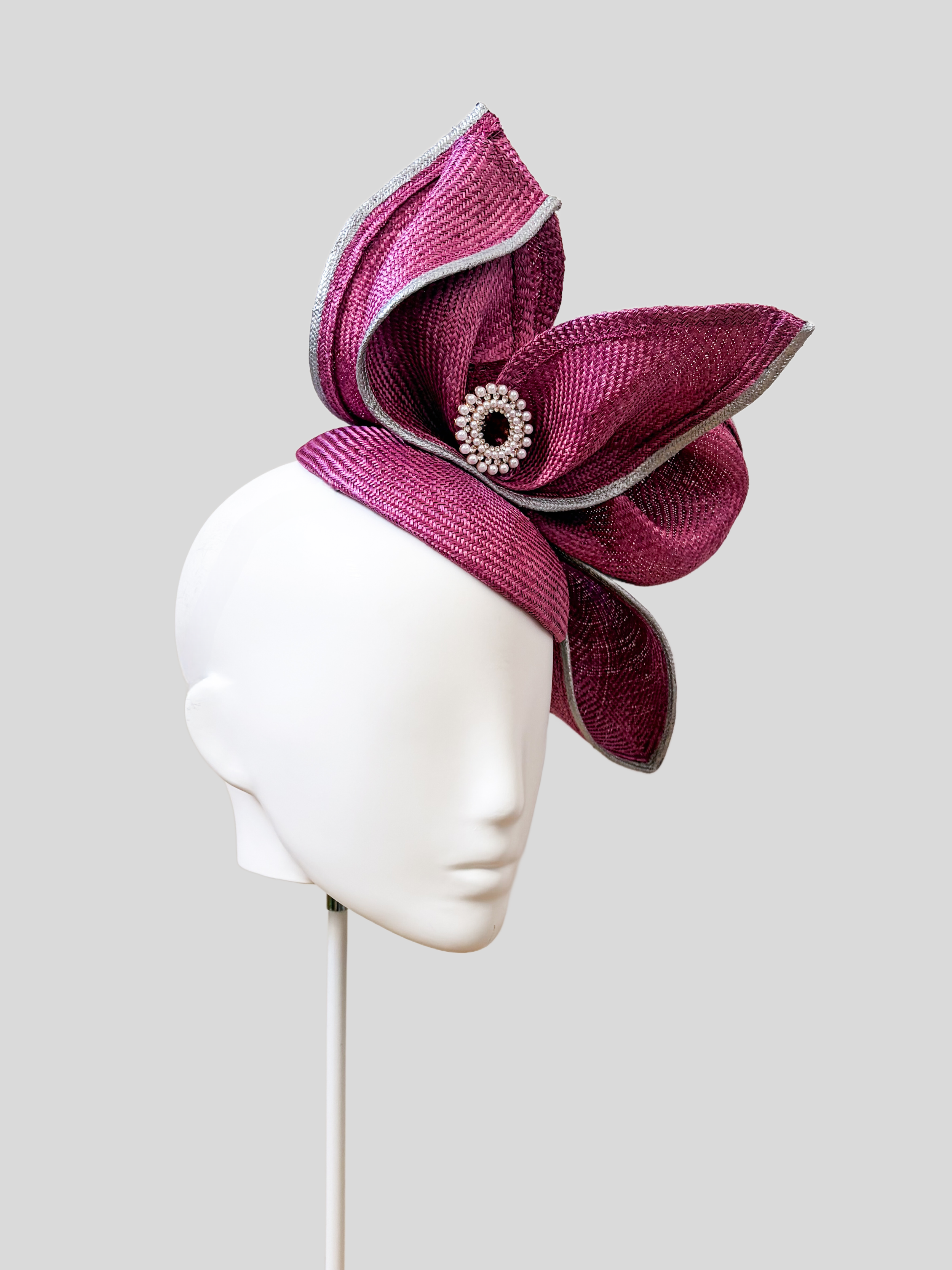 Aria Amethyst sculptural headpiece shown from the left side.