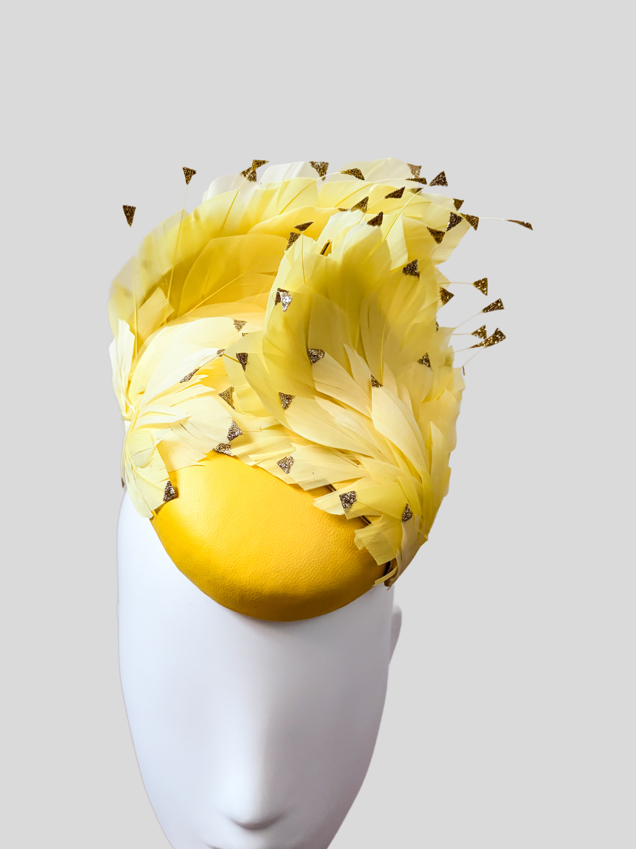 yellow-feather-fascinator-mini-hat-close-up-view.jpg.png