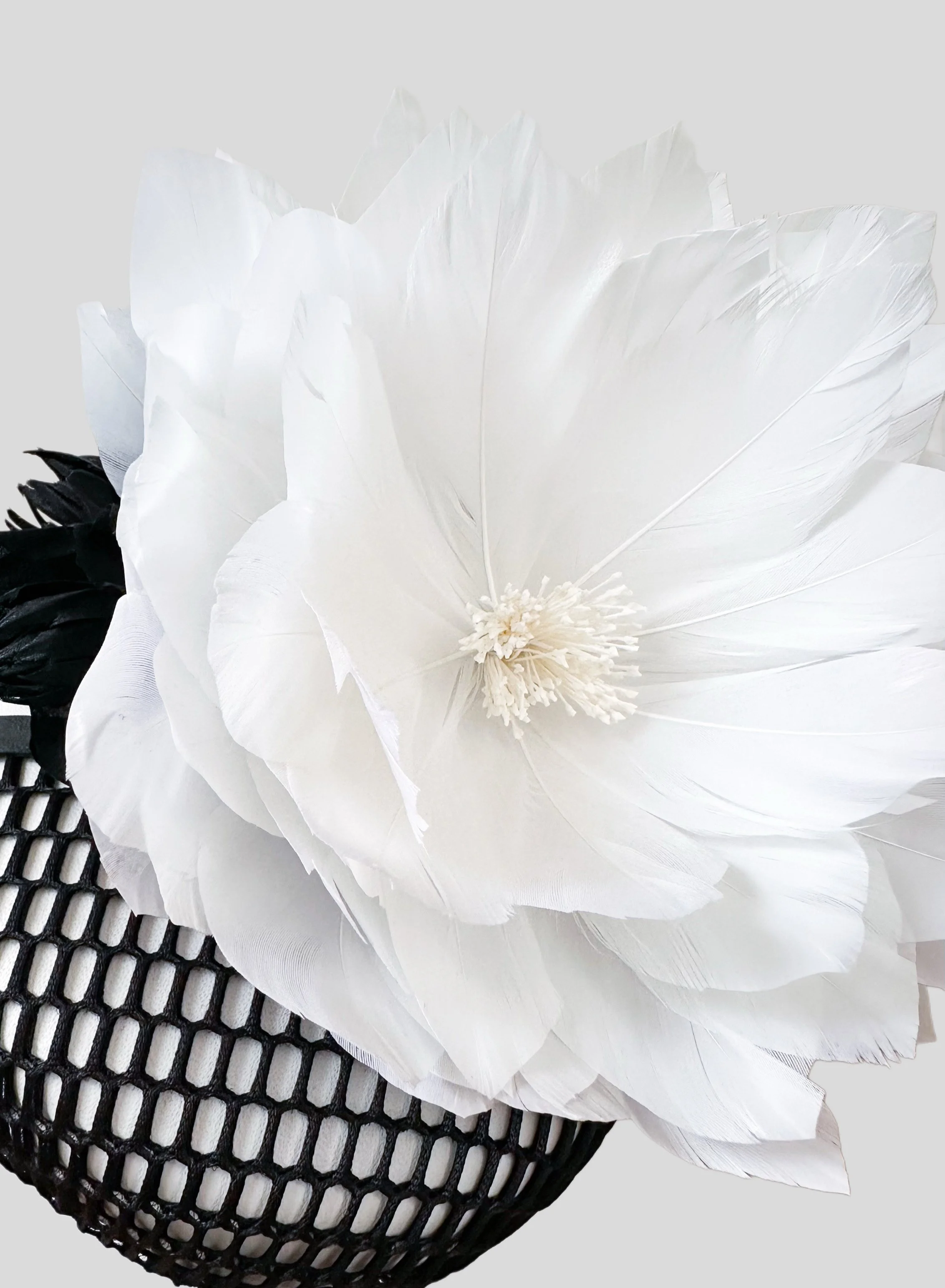 This Fiore Bianco cocktail hat is a one-of-a-kind piece, perfect for Derby Day and beyond.