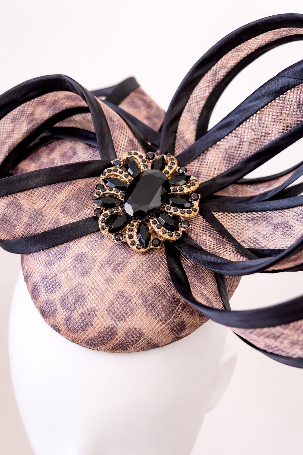 Elegant fascinator with black and gold brooch.JPEG