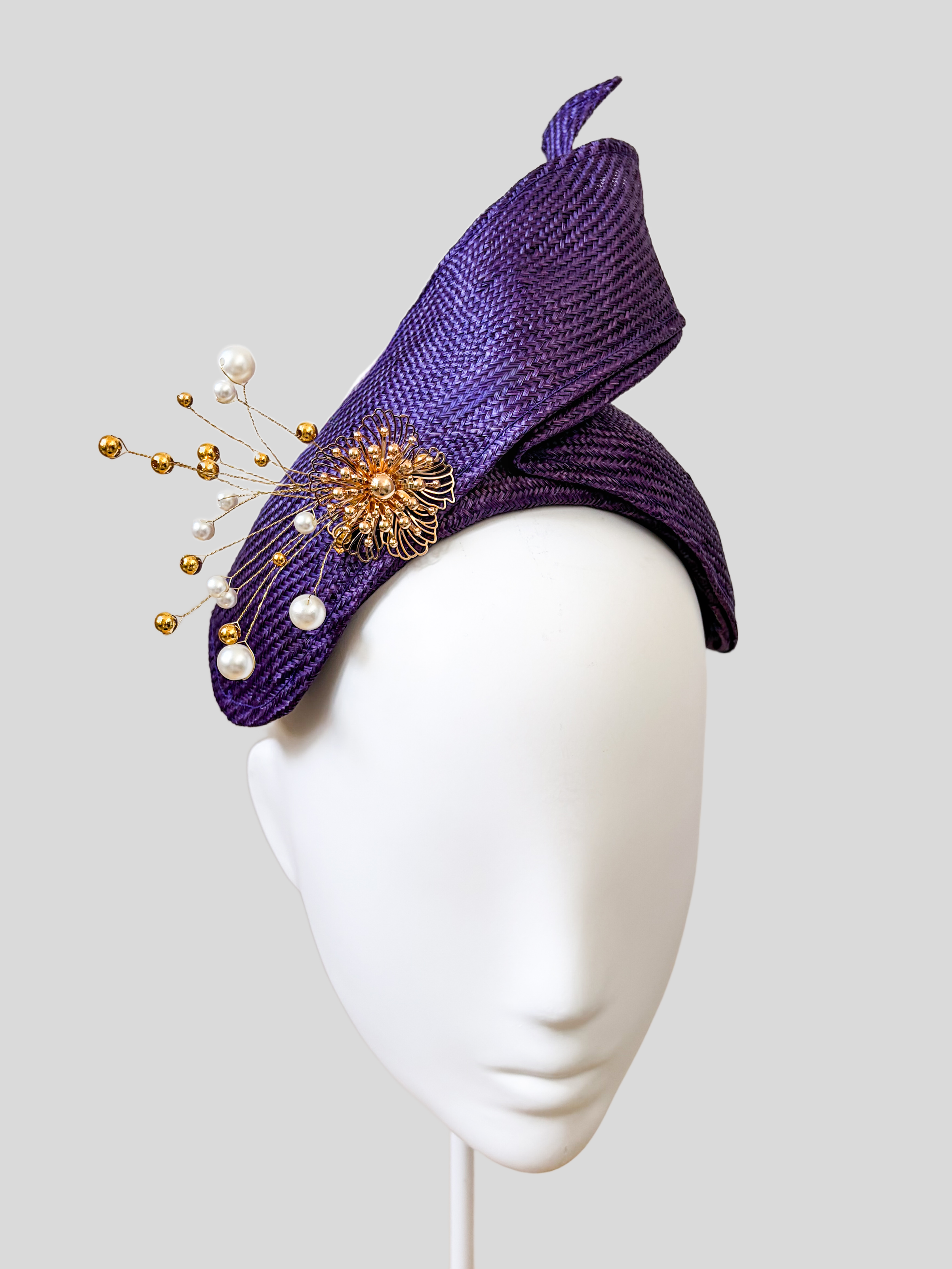 Left: Side view of the SÉLÈNE Amethyst Parisisal bandeau headband showcasing its twisted sculptural Parisisal detail.