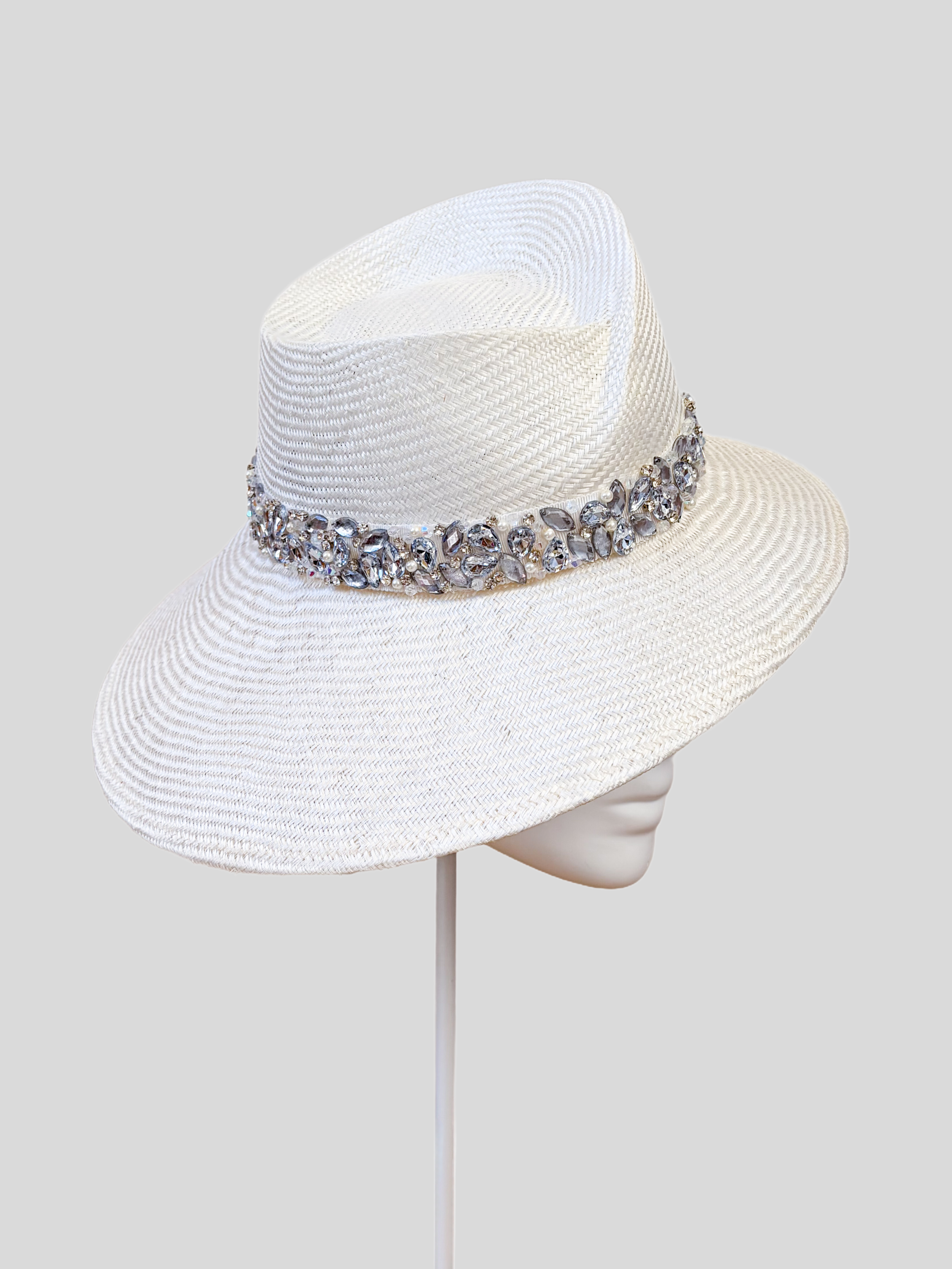 Left: Side view of the MAISON Pearl Parisisal fedora showcasing its sculptural crown and hand-embellished band.