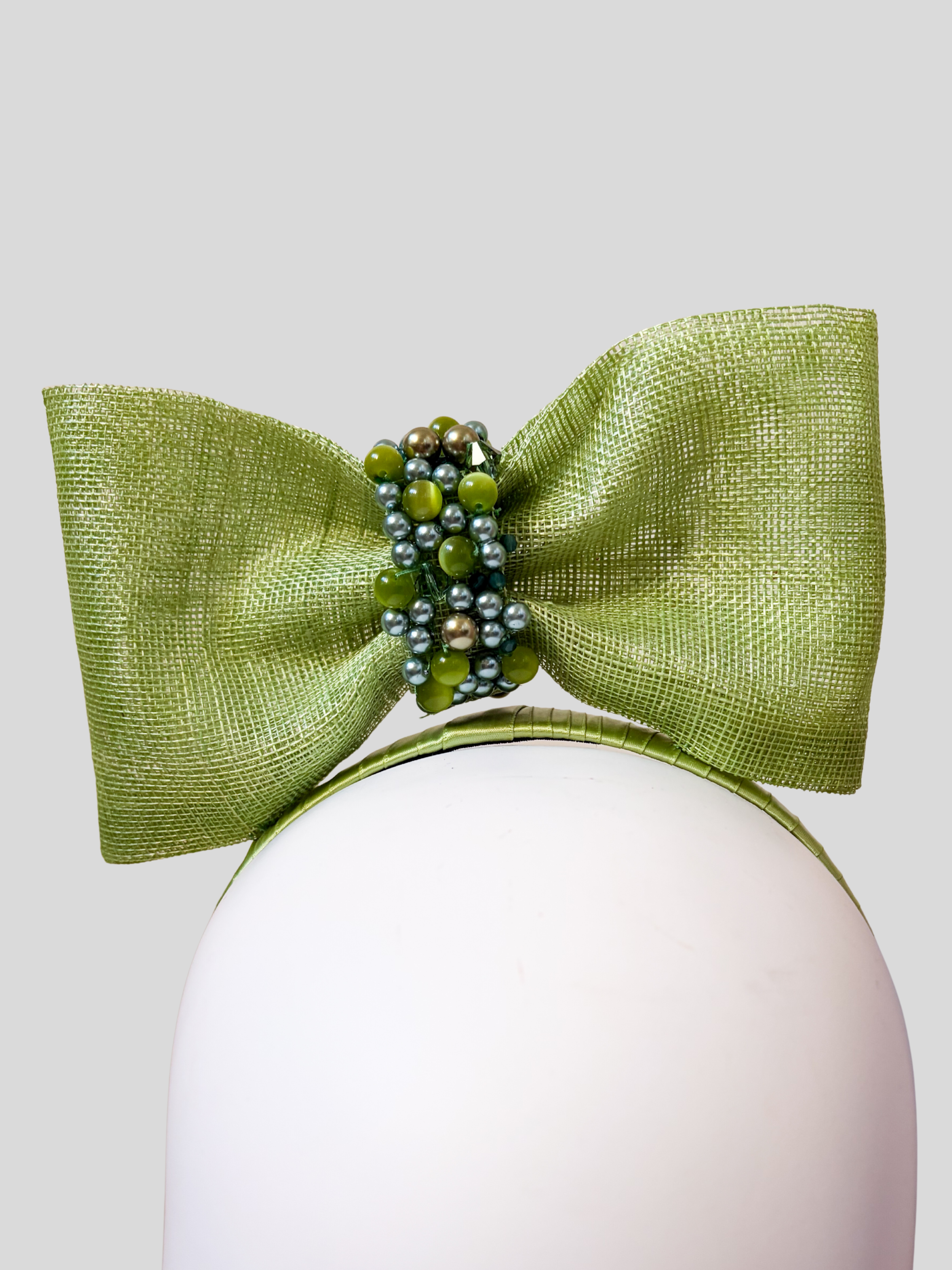 green-sinamay-headband-bow-swarovski-beads-close-up-view.jpg.png