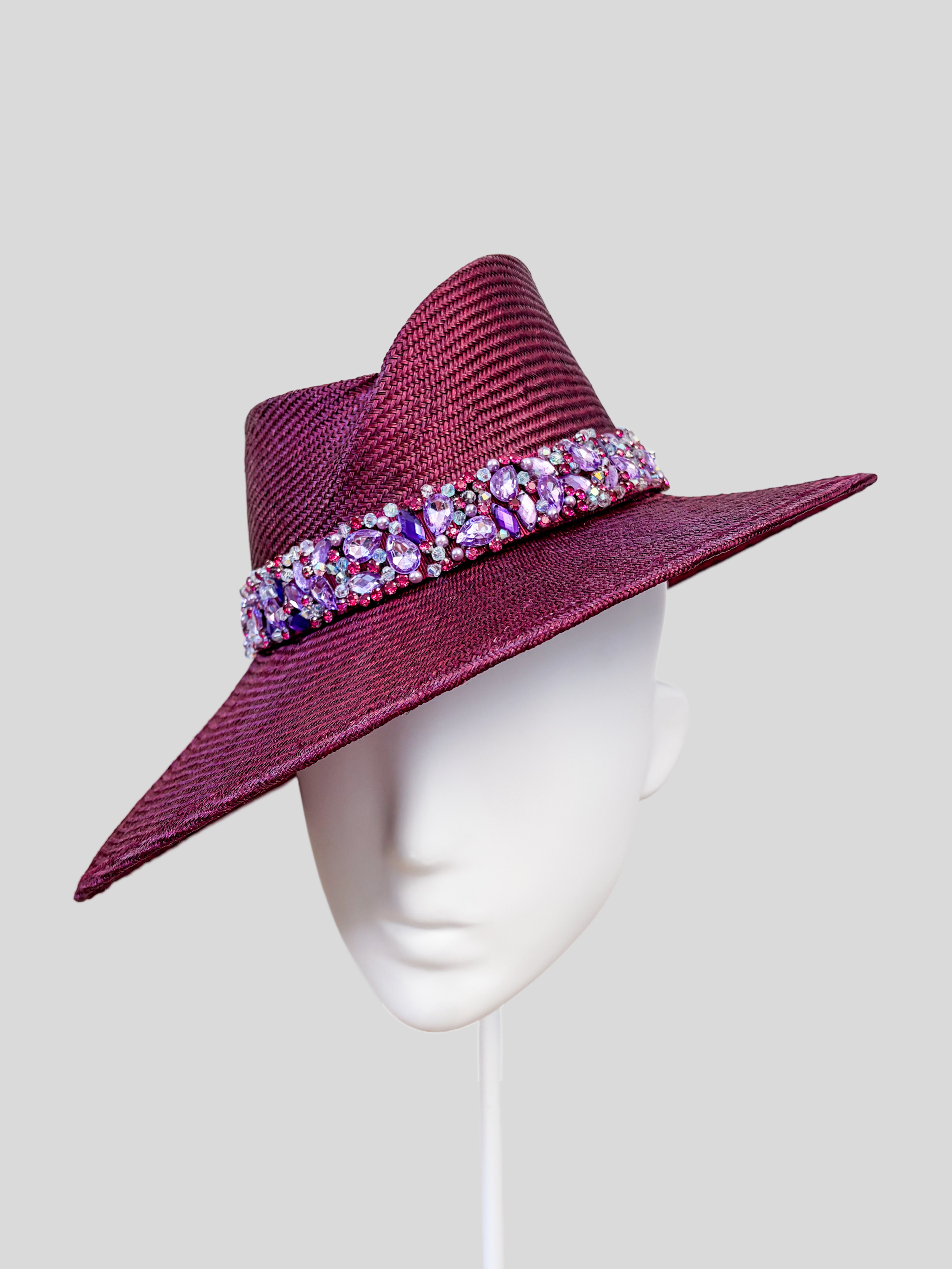 Right: Right-side view of the MAISON Amethyst Parisisal fedora with its rich amethyst finish and detailed purple embellishment.